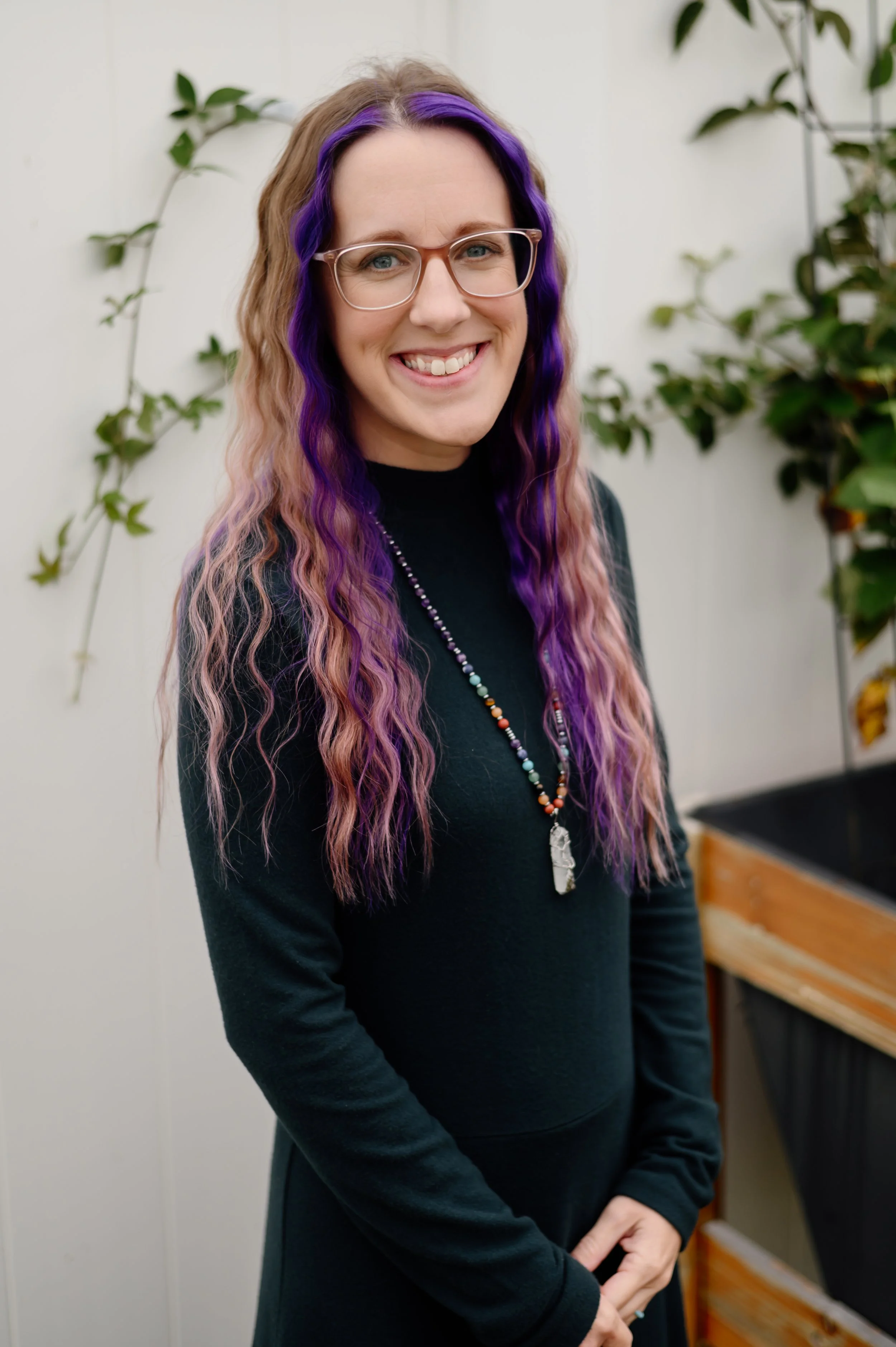 Portrait of Kat Harrison, artist and teacher, connecting with her audience through presence and authenticity.