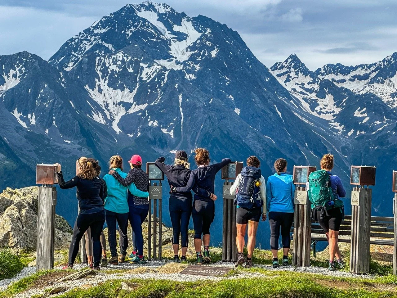 Group of hikers looking at scenic mountain view