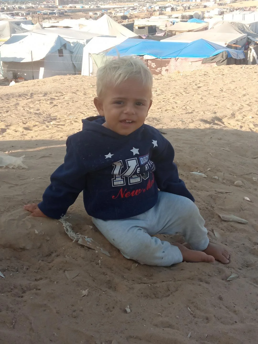 Fadi Qadih child in sand 12-09-25.jpeg