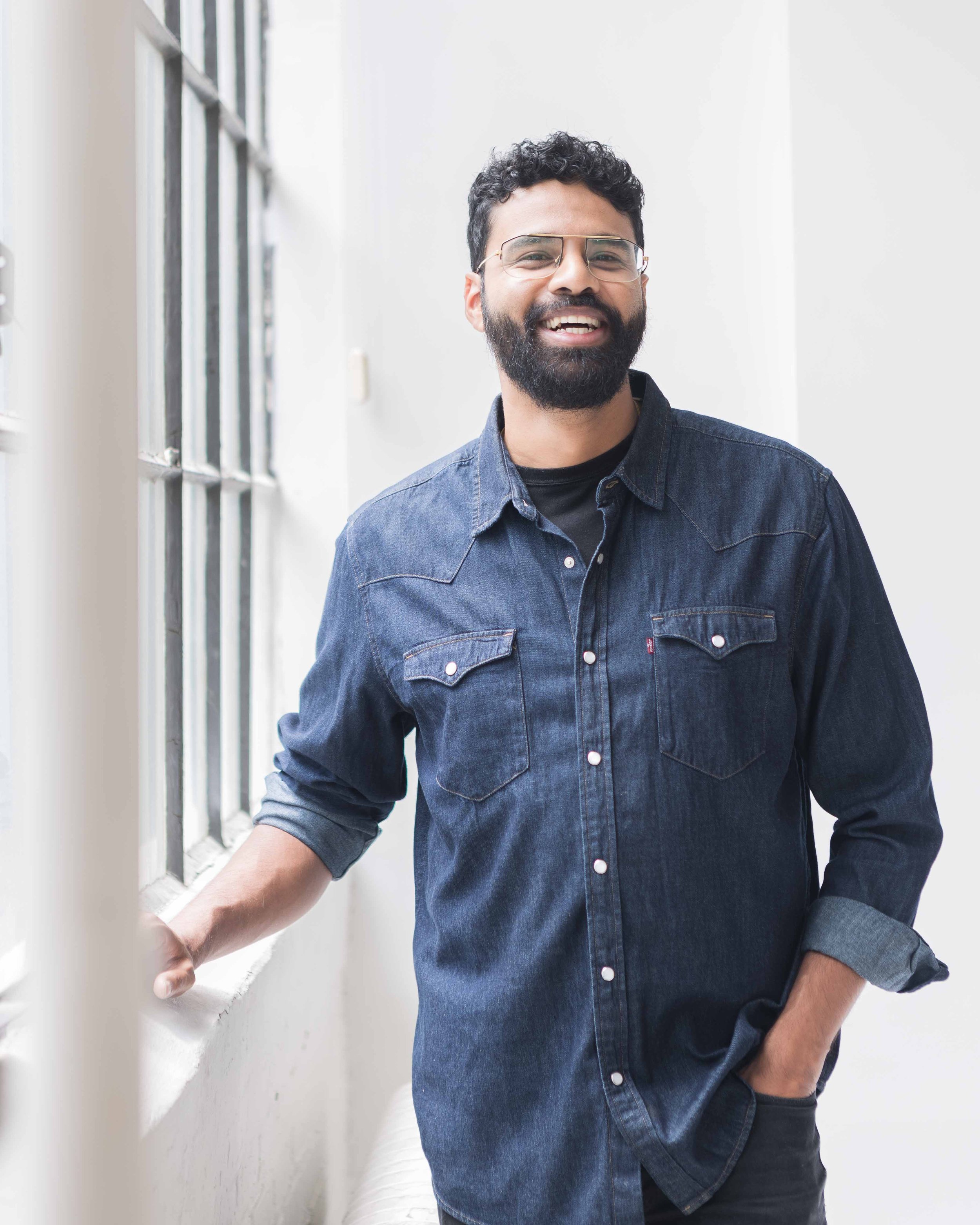 tv producer standing by window, personal-brand-photography-.jpg