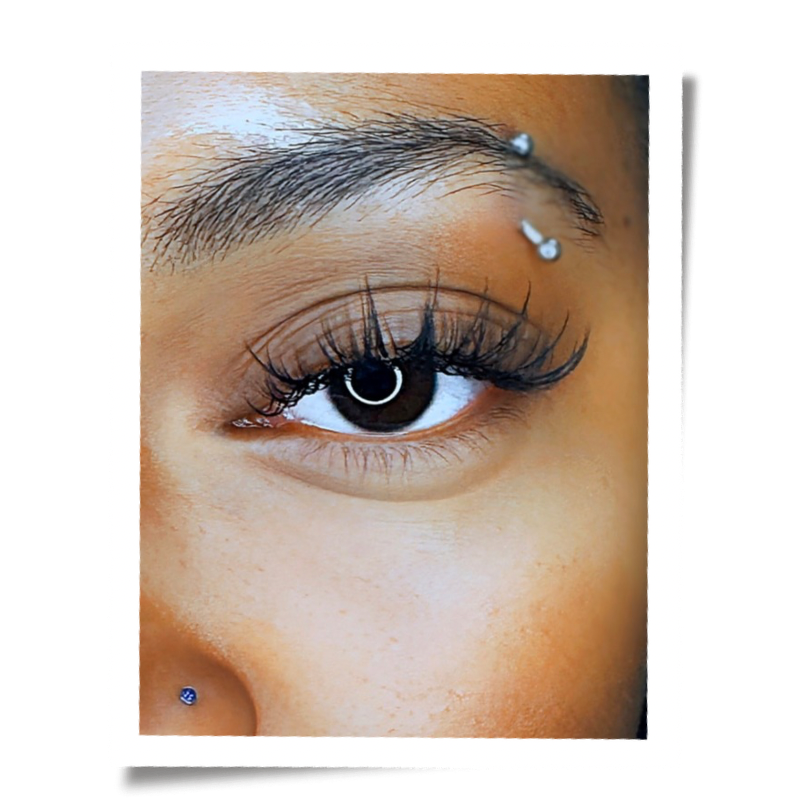 Close-up polaroid of a handcrafted custom eyelash extension set by Flaunt and Flutter Lashery in York PA