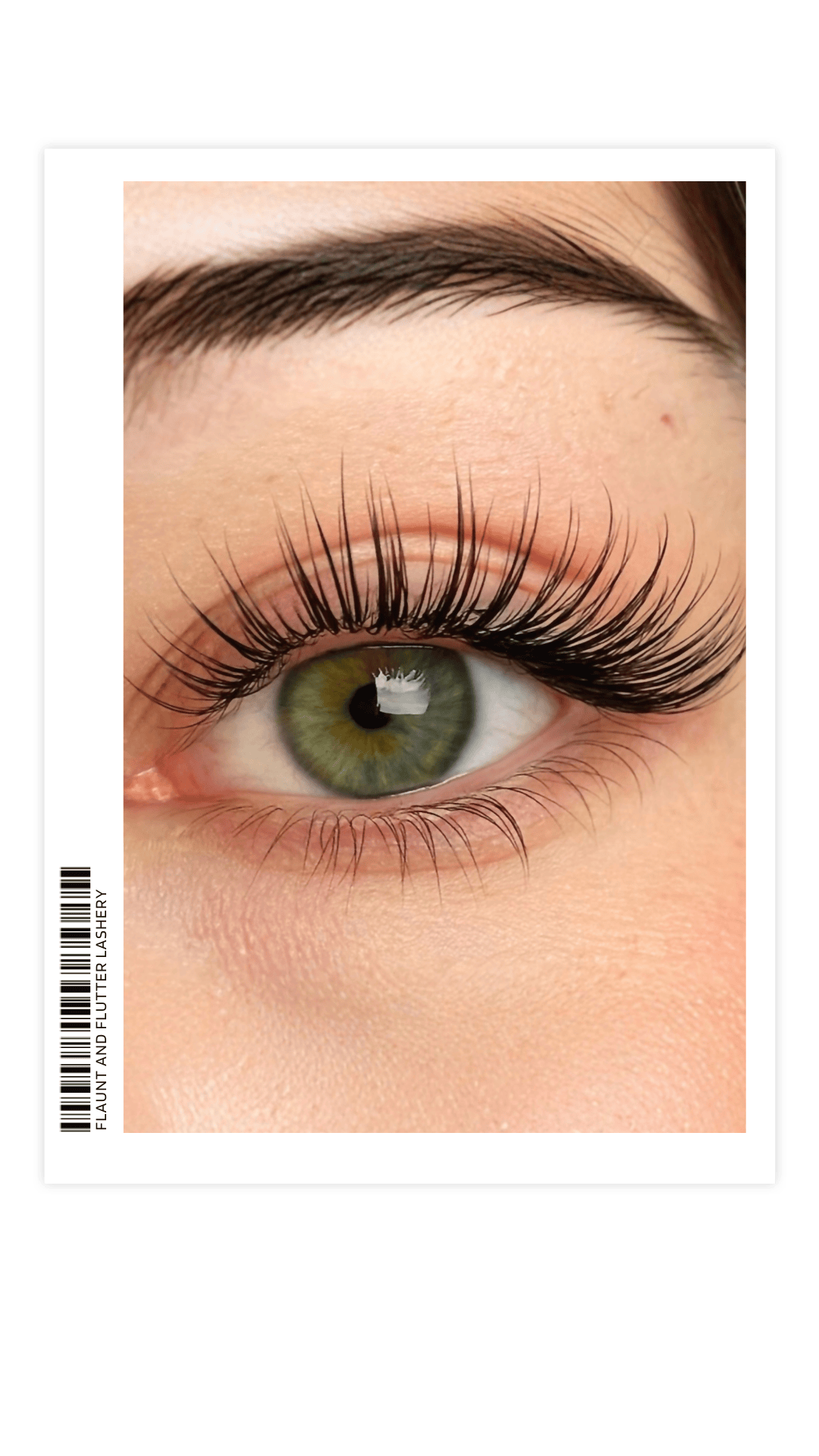 Close-up of a human eye with lush eyelash extensions, showing the green iris and surrounding skin.