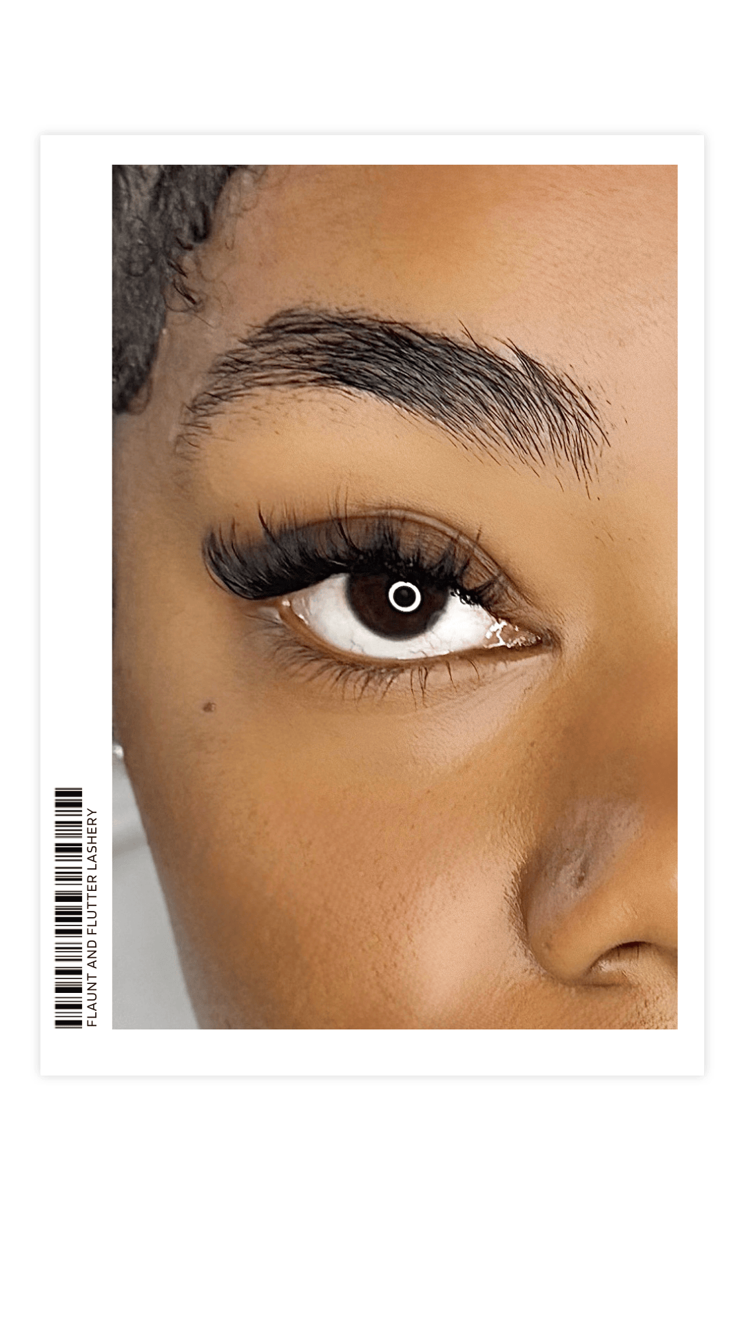 Polaroid graphic showing a close-up of custom volume eyelash extensions from the Handcrafted Signature Set at Flaunt and Flutter Lashery in York PA