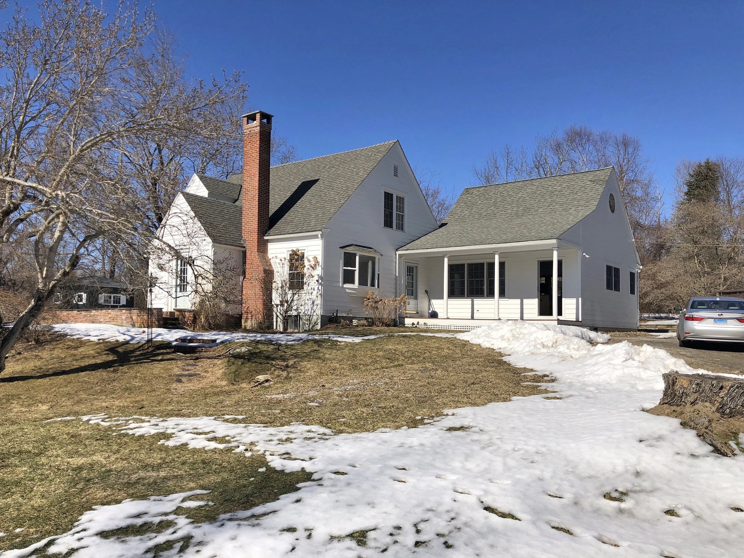 Before: A view of the original house from the driveway.