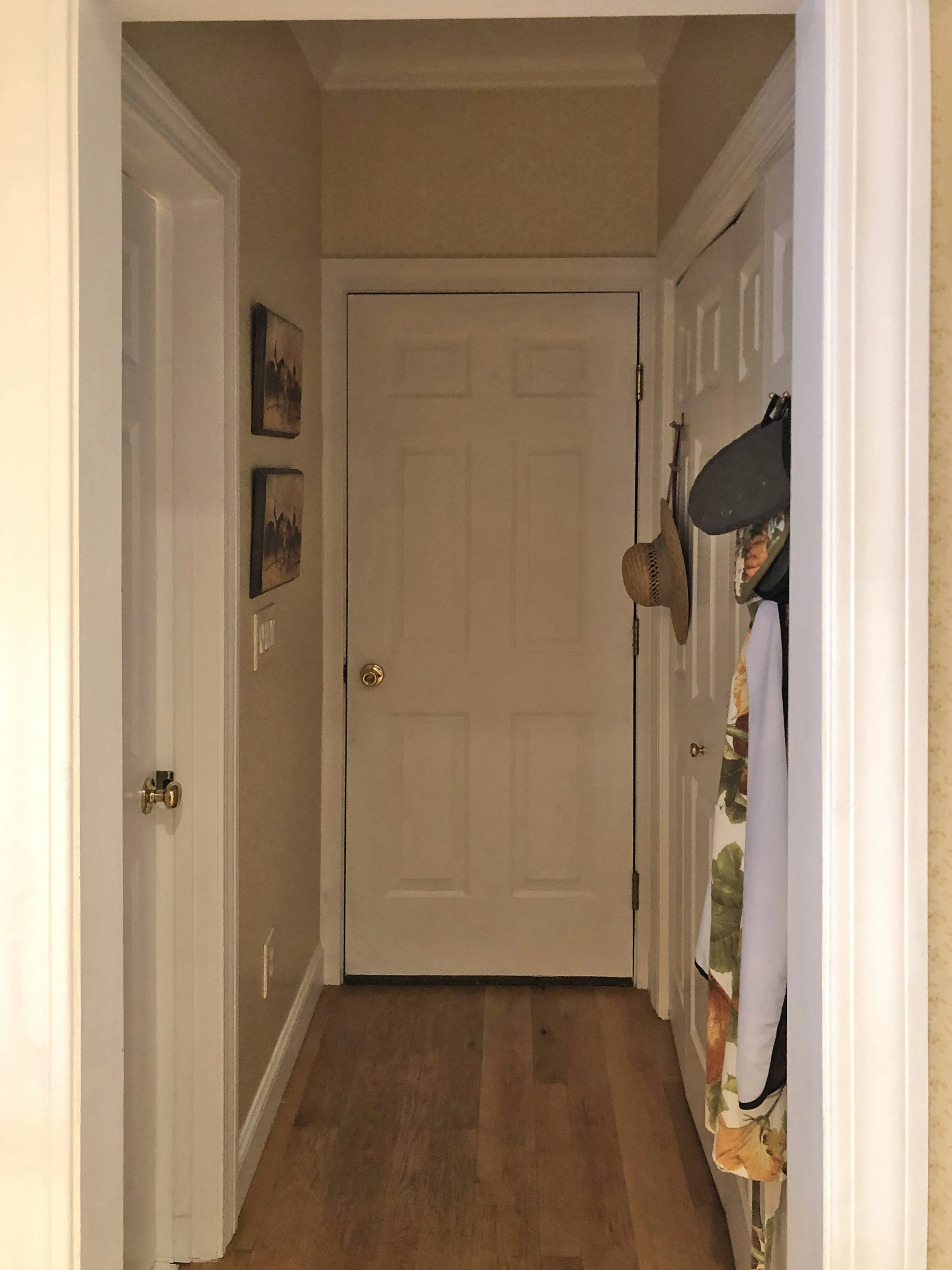 Before: A dark, narrow hallway lacked charm and function as a mudroom, with a cramped washer-dryer closet and an oversized powder room.