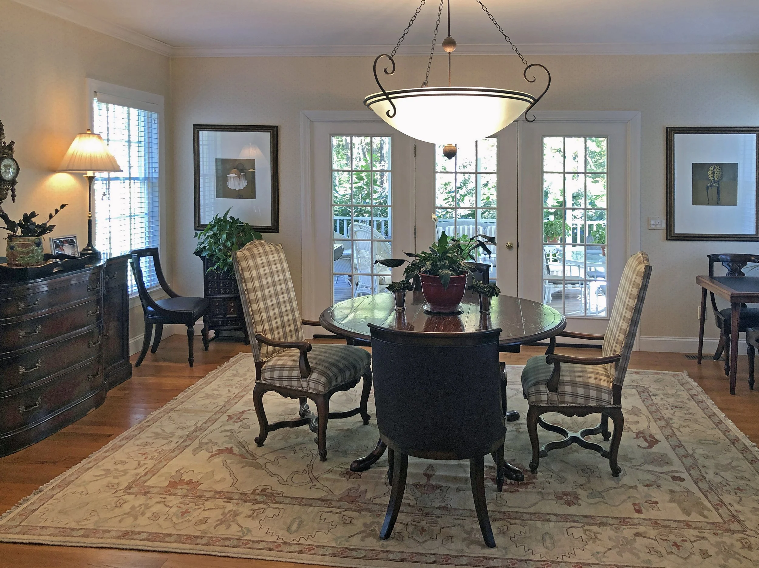 Before: Used as a dining space, the furniture plan blocked the flow to the screened porch.