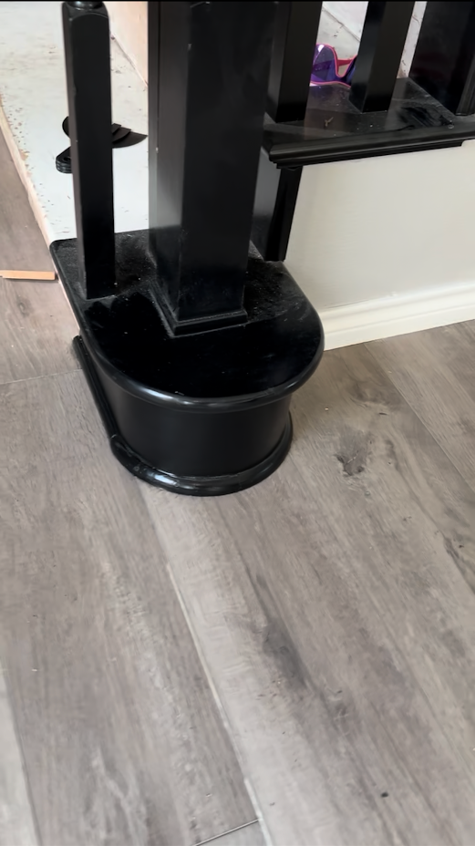 Custom cut flooring and quarter round for stair handrail 