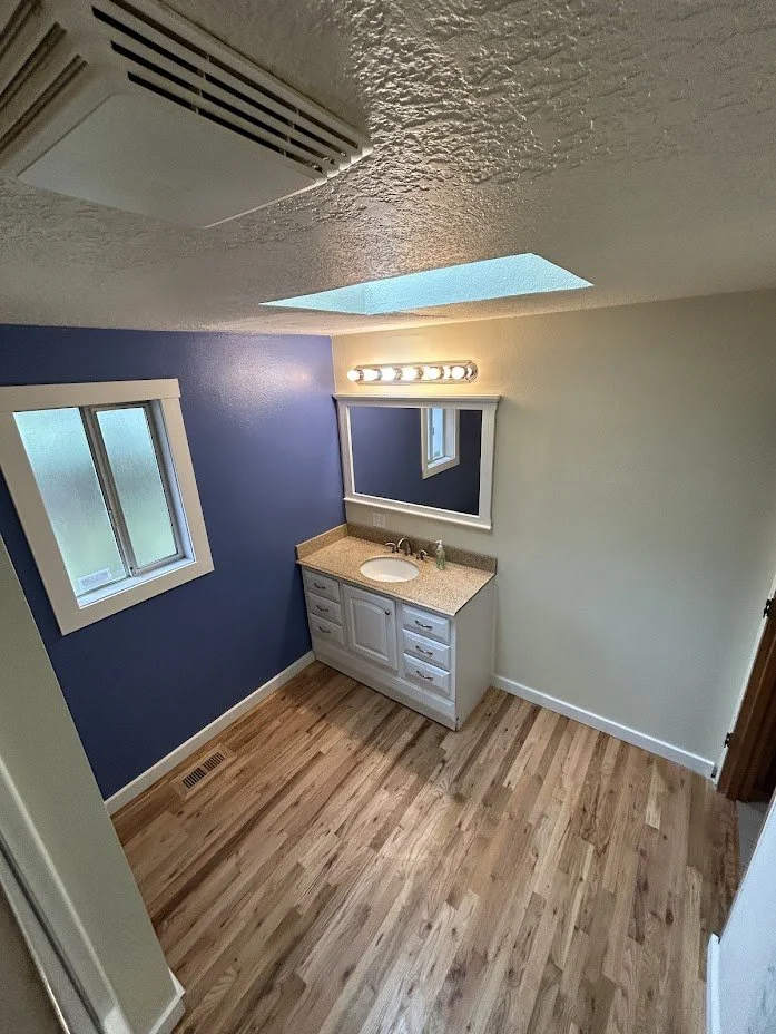 Bathroom Remodel including drywall repair, vanity install, trim install and painting.