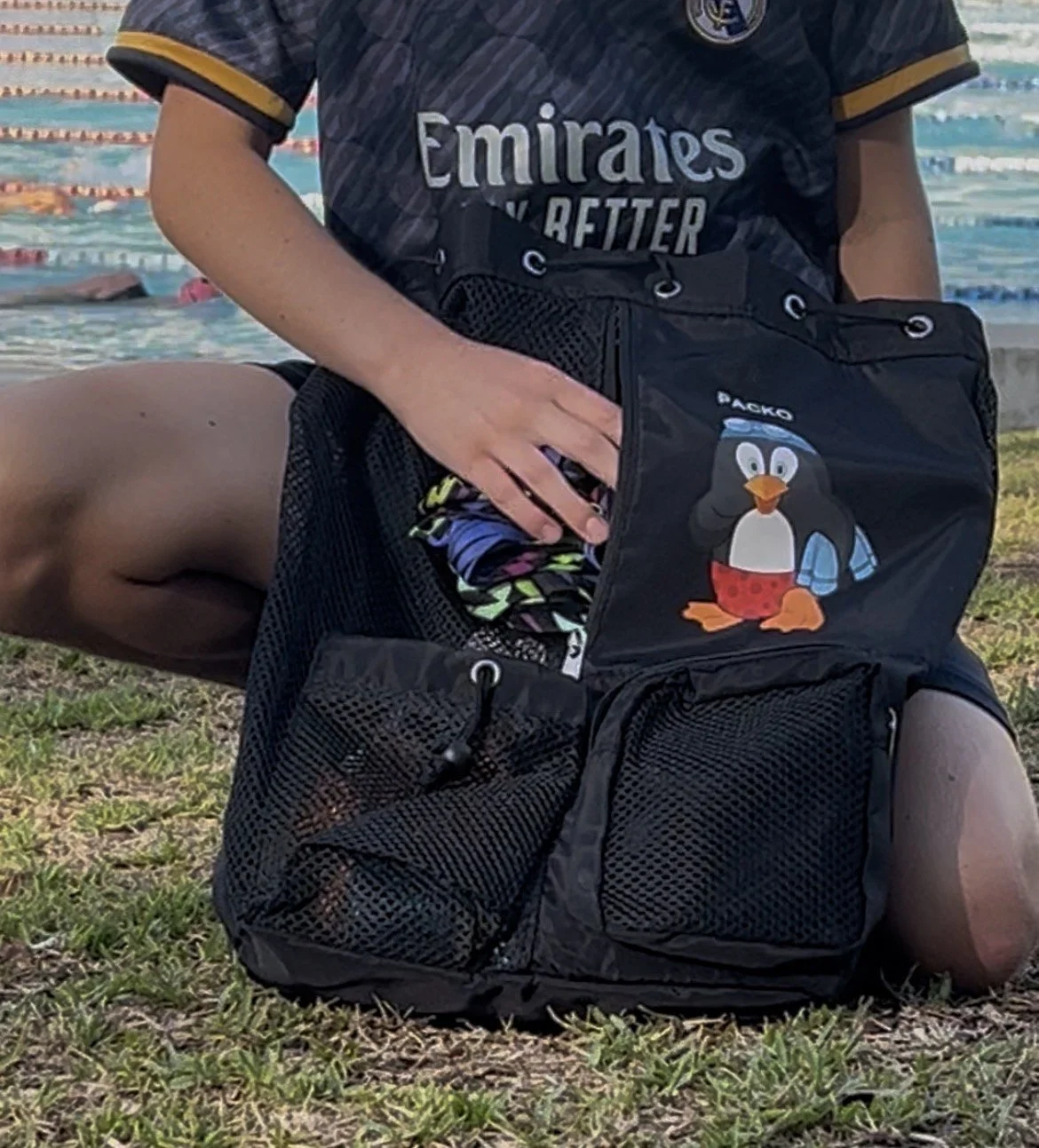 Close up of putting wet swimmers into Packo wet pocket.jpg