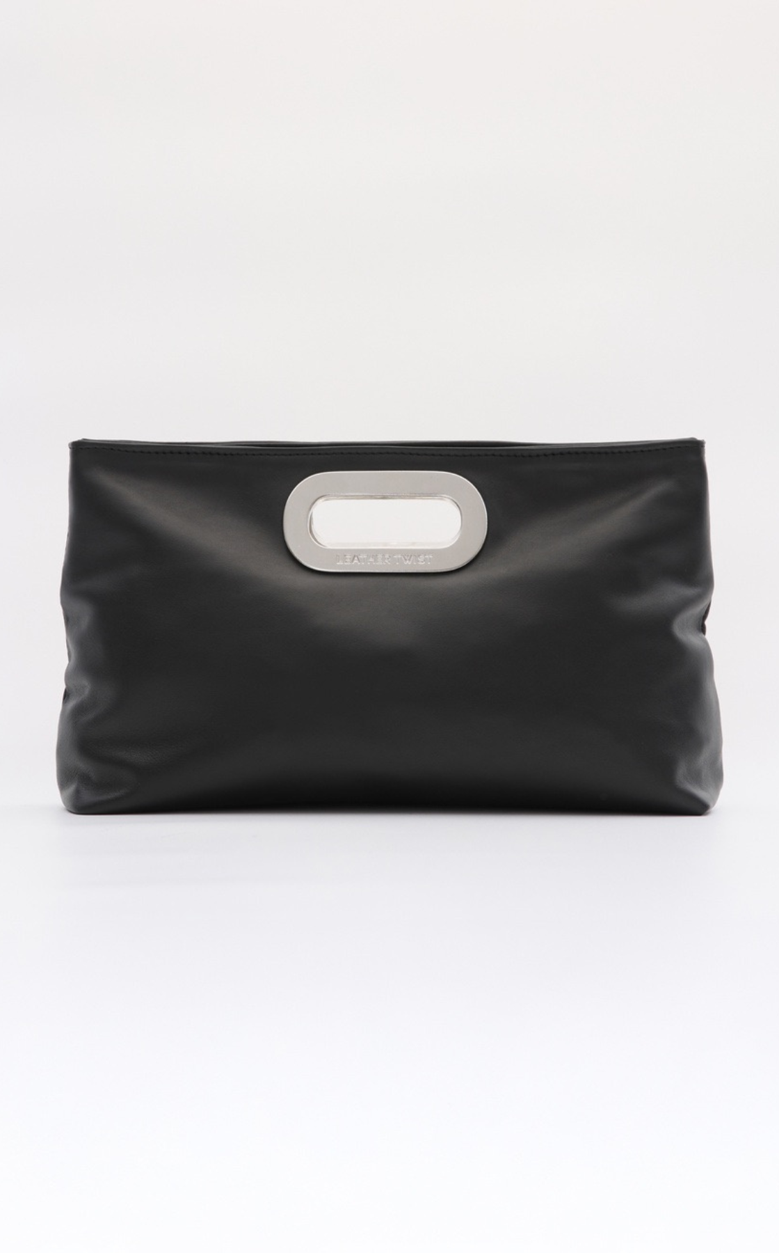 Black clutch purse with a silver handle and the words 'BEATRT WST' engraved on it, against a white background.