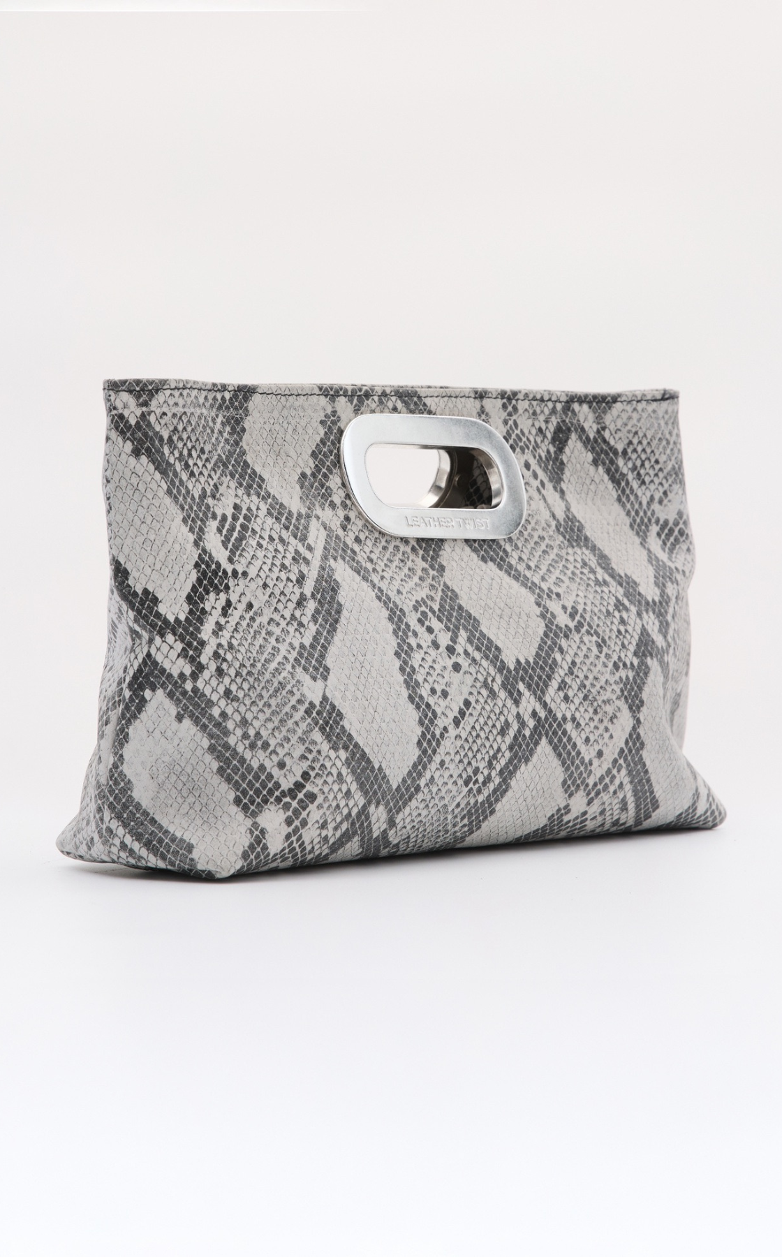Gray and black snakeskin patterned tote bag with cutout handle and metallic accent.