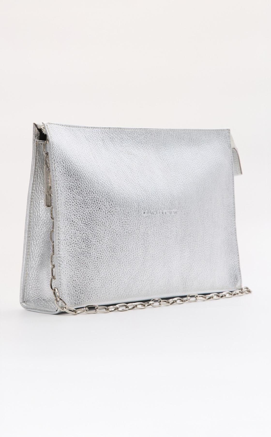 A silver, textured clutch purse with a chain strap and zipper on the side, set against a plain white background.