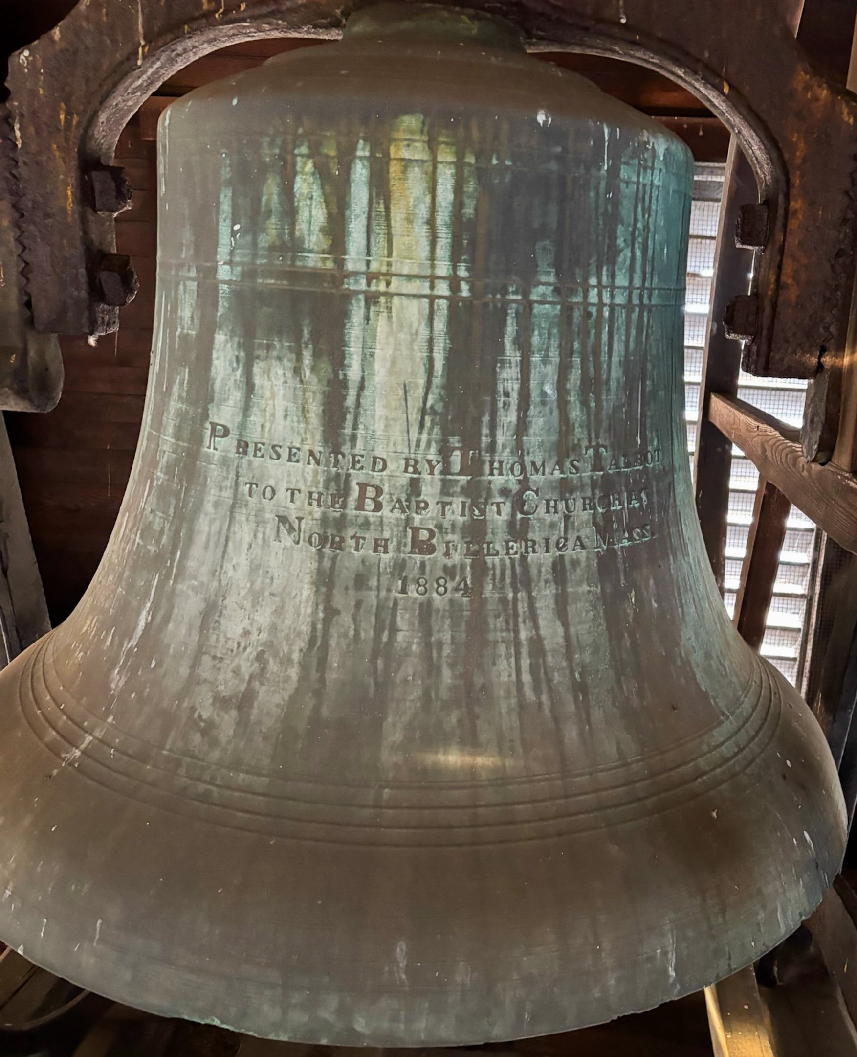 Large historic church bell with inscription "Presented by Thomas Talbot to the Baptist Church, North Billerica, Mass. 1884.”