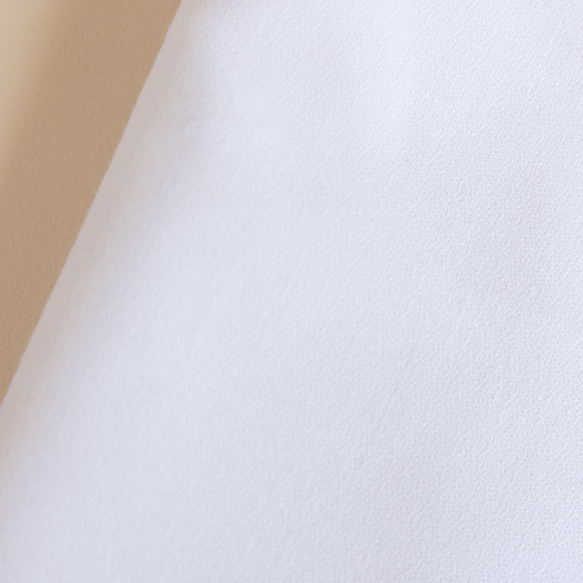 Close-up of a white textured ova White Event  Table Linen