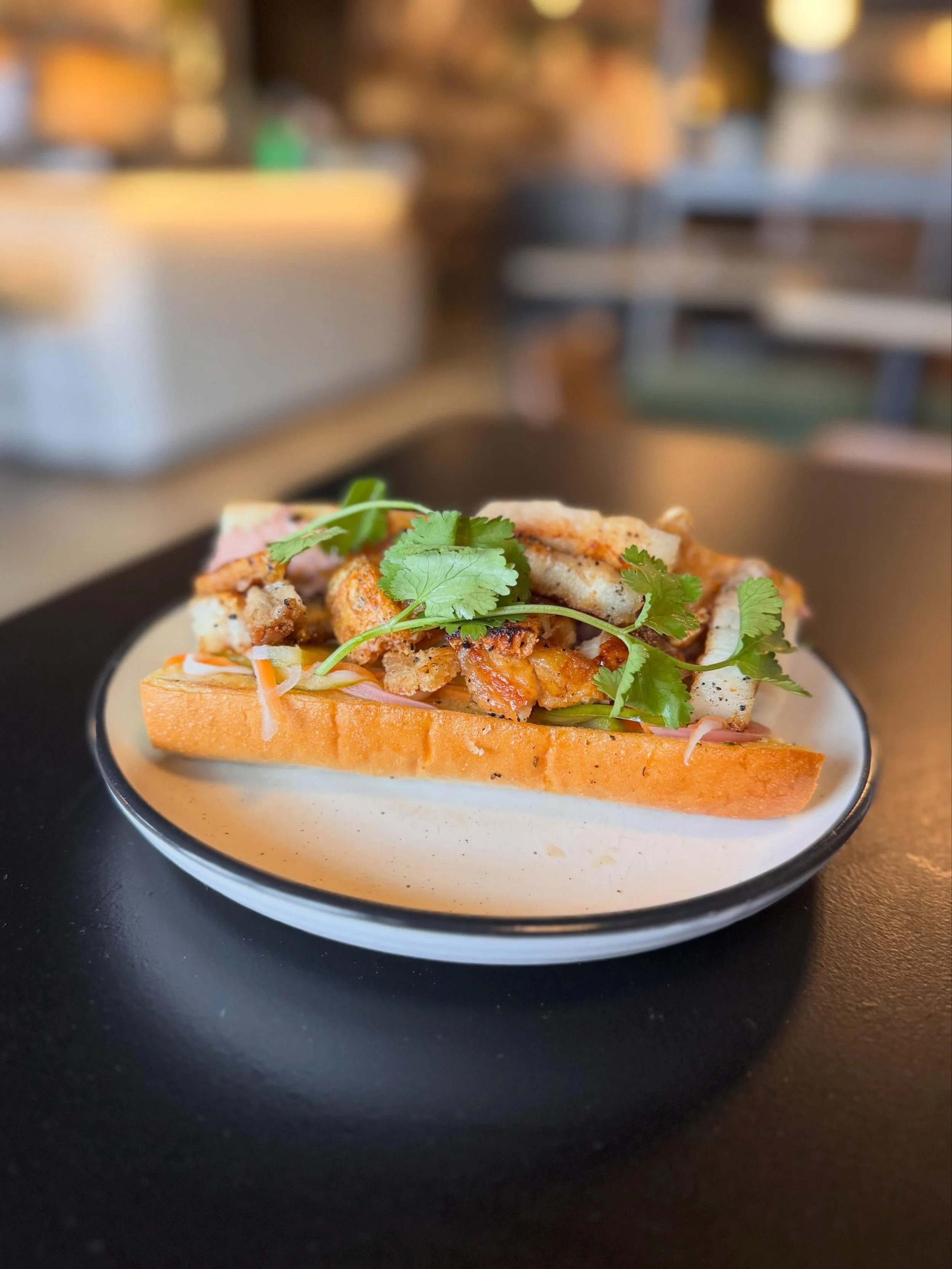 Meet the newest addition to the Little Ed roll lineup.

Crispy pork belly, rich p&acirc;t&eacute;, pickled onions, fresh carrot, cucumber &amp; coriander, all packed into a soft toasted roll.

Every roll comes served with potato crisps and is availab
