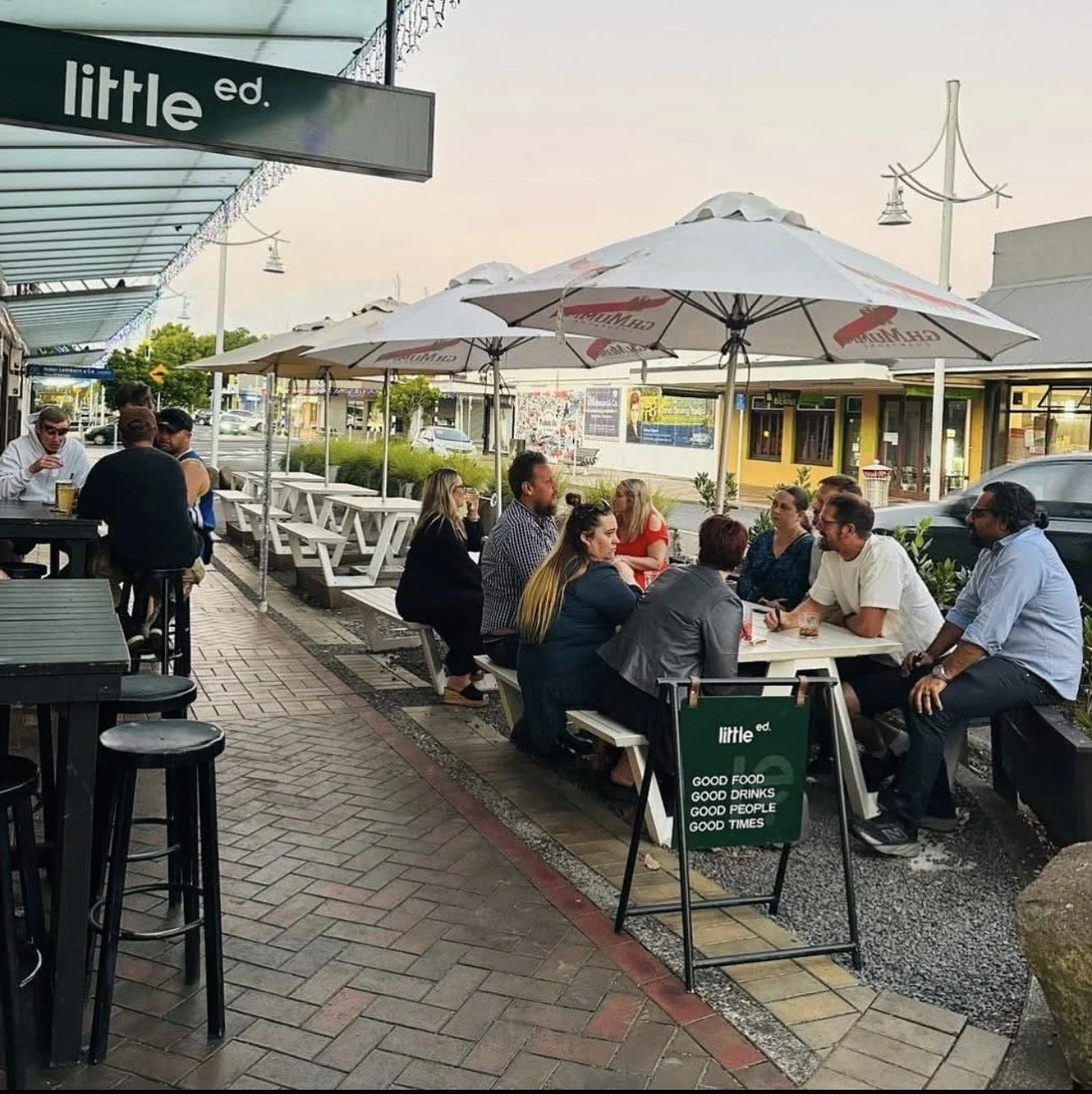 Customers outside Little Ed enjoying $10 Sunday