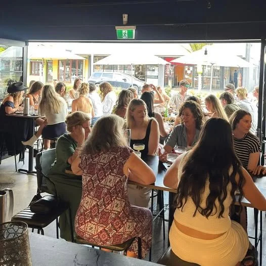 People sitting at tables for the Little Ed Pukekohe Bottomless Lunch.