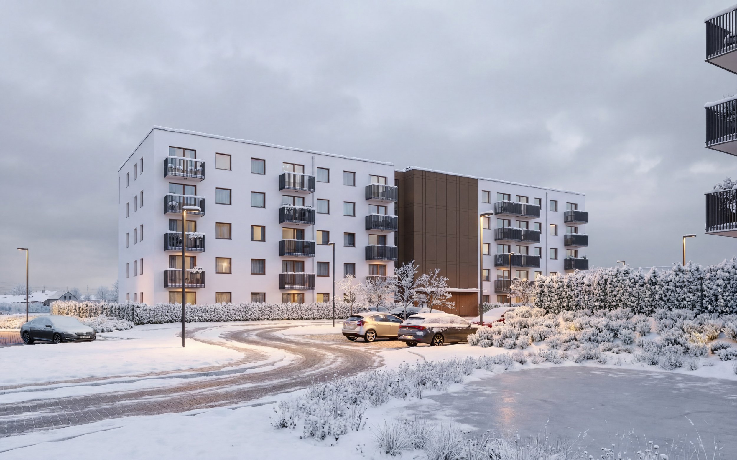 A modern apartment complex in a serene winter setting, with snow-covered ground, trees, and parked cars under a cloudy sky. Gdańsk.  Kamil Rombczyk portfolio architectural vizualization. Kamil Rombczyk portfolio wizualizacje architektoniczne. Wizuali