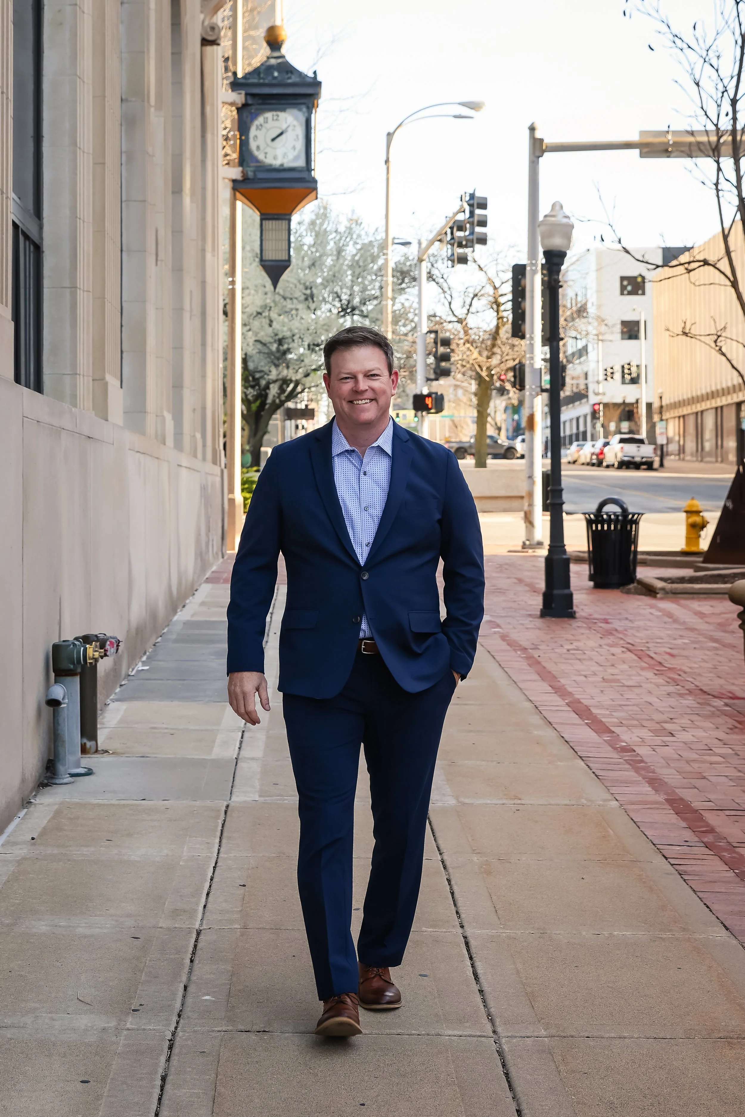 Dustin James, Keynote Speaker, walking downtown