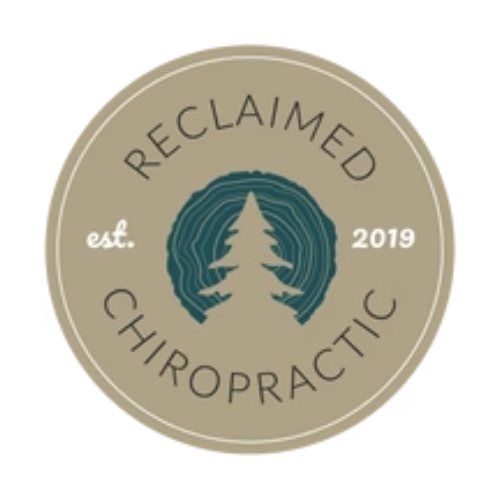 A circular logo with a beige background and dark beige text that reads 'Reclaimed Chiropractic, est. 2019'. The center features a teal pine tree silhouette surrounded by concentric teal rings.