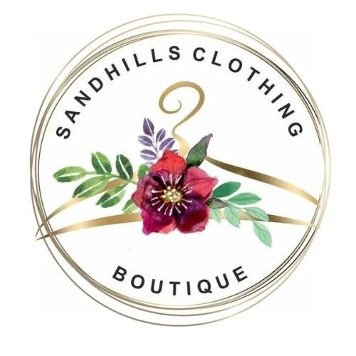 Logo for Sandhills Clothing Boutique featuring a gold swan, red flower, purple smaller flower, and green leaves inside a circular design.