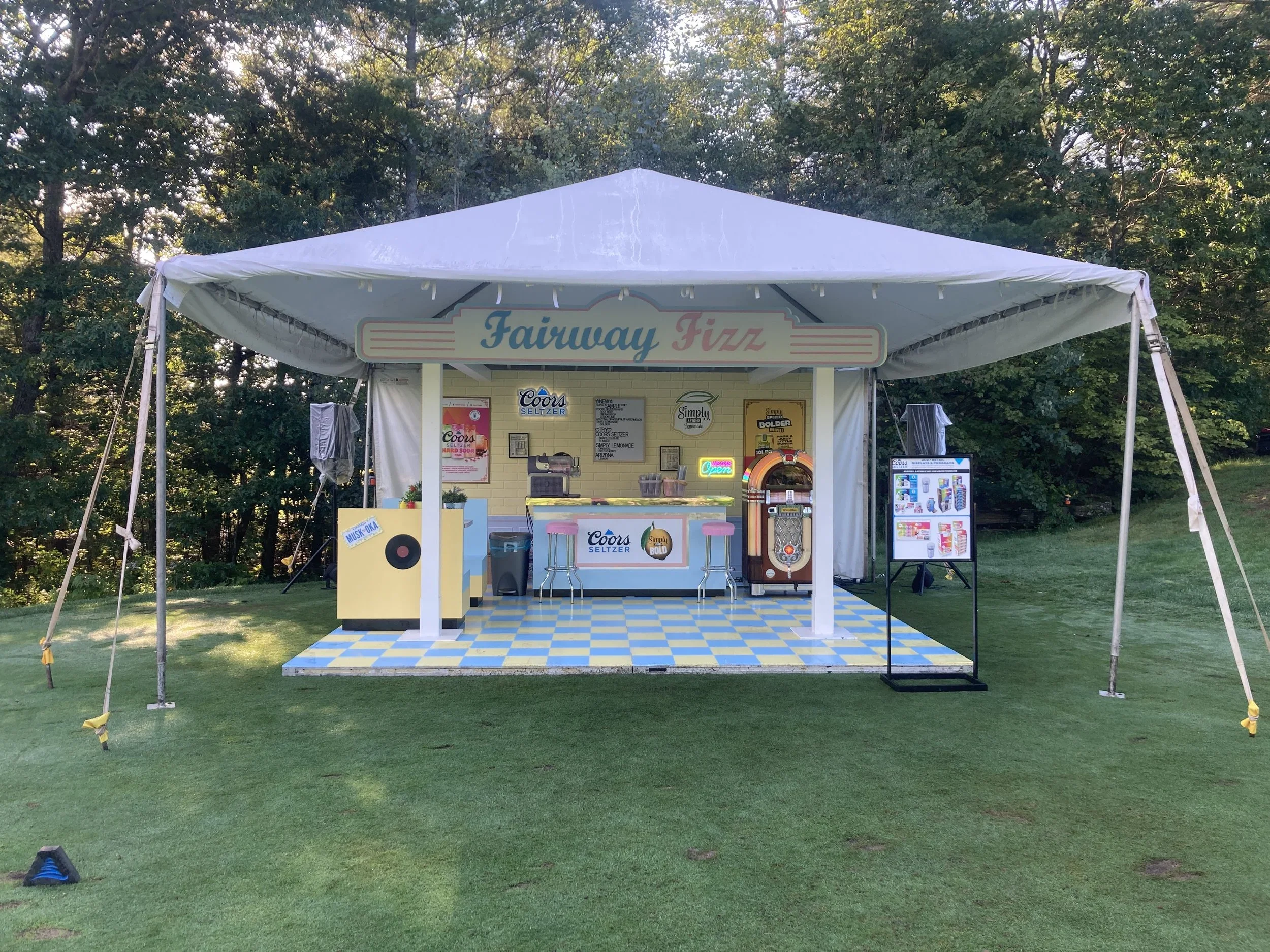 Outdoor activation - tent, custom flooring and fabricated pillars and signage 