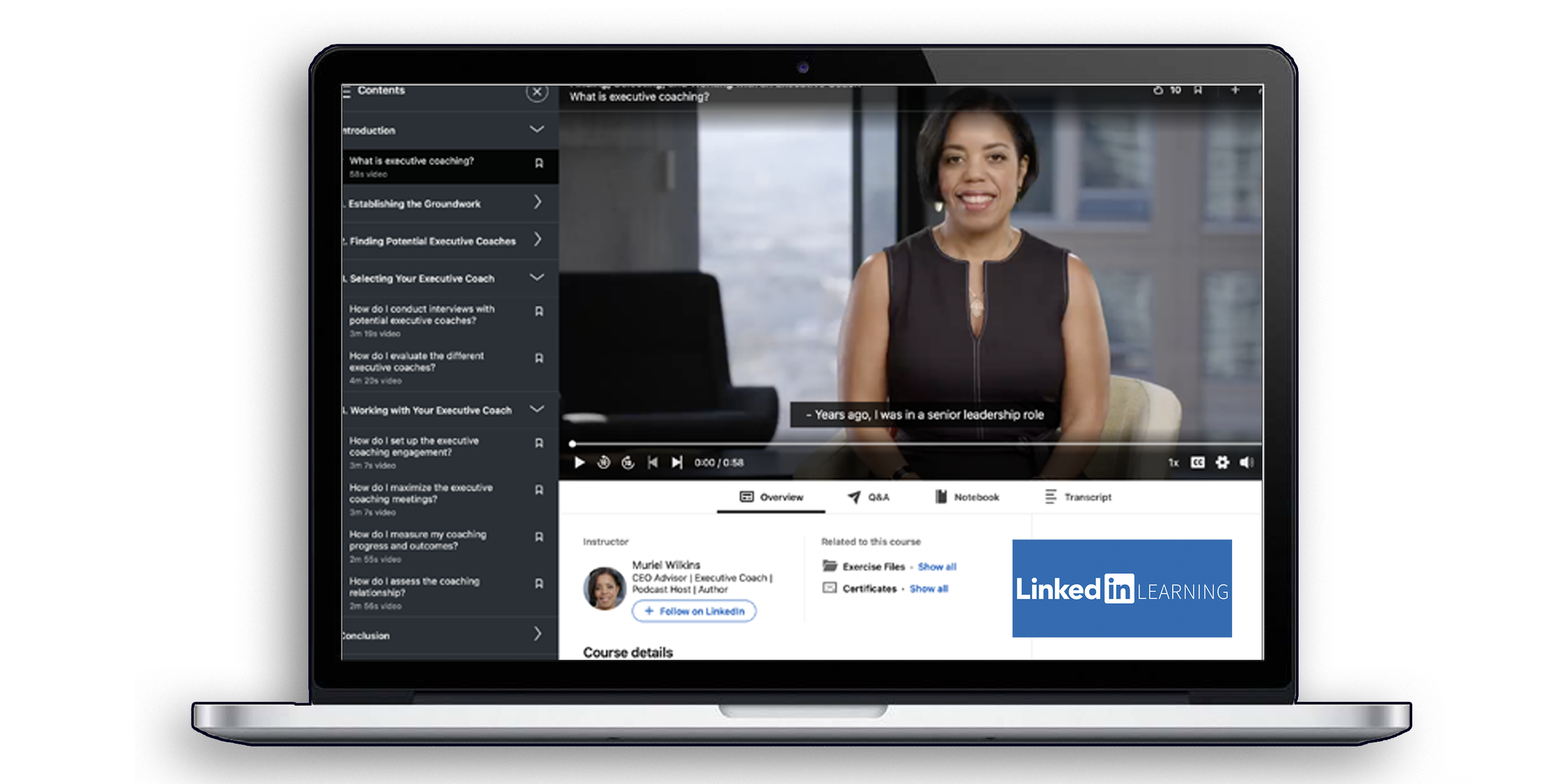 Laptop screen displaying an online course about executive coaching, with a video of a woman speaking, subtitles, and navigation options including overview, Q&A, notebook, and transcript. The course instructor is Muriel Wilkins, CEO and executive coach, and there is a LinkedIn Learning logo on the bottom right.