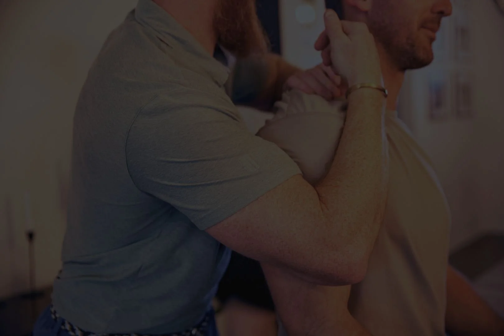 Client receiving physical therapy with Dr. Anthony Winn, founder of PT² and The Weighting Room in a home setting