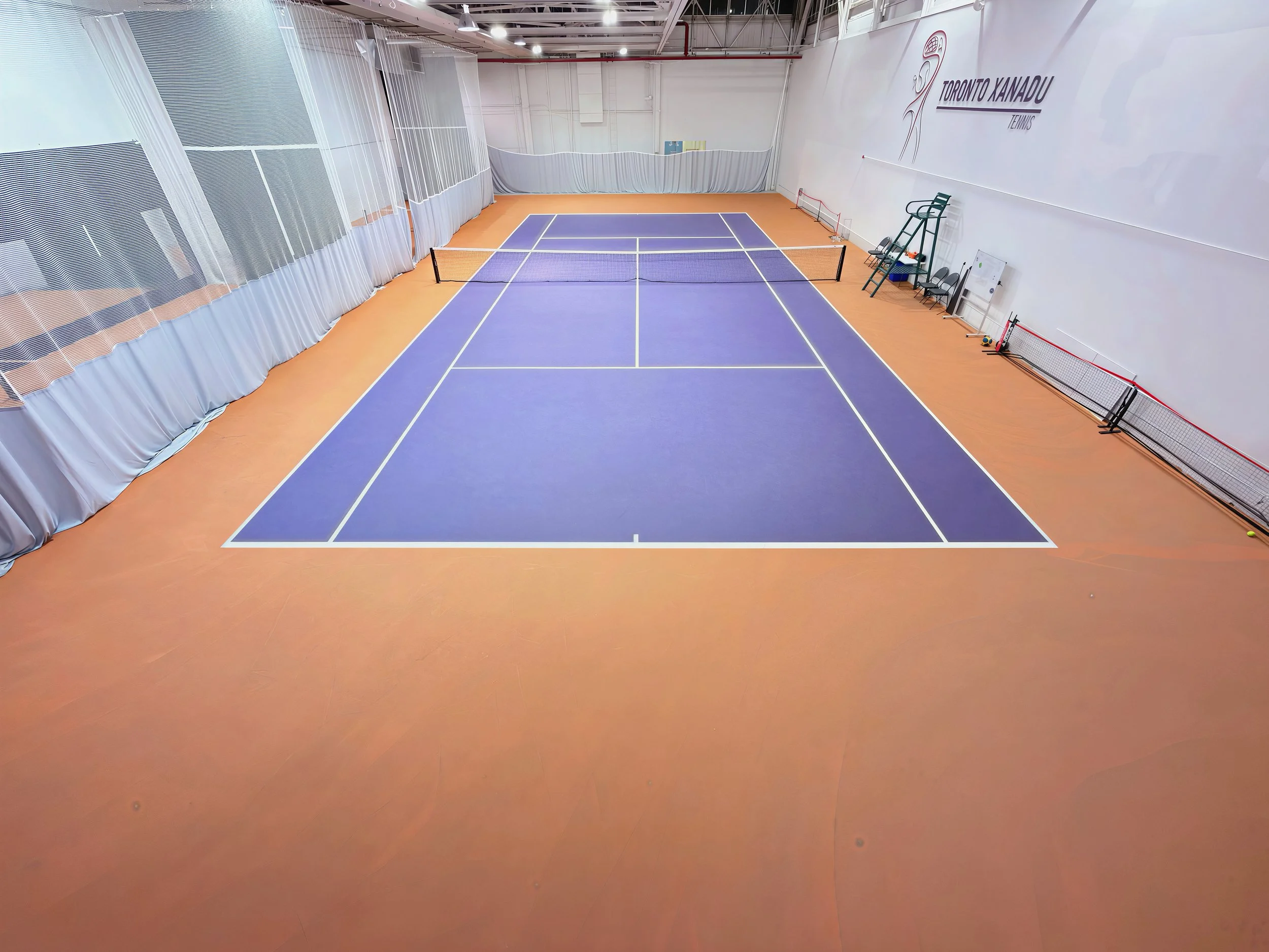 Indoor purple tennis court at Toronto Xanadu Tennis