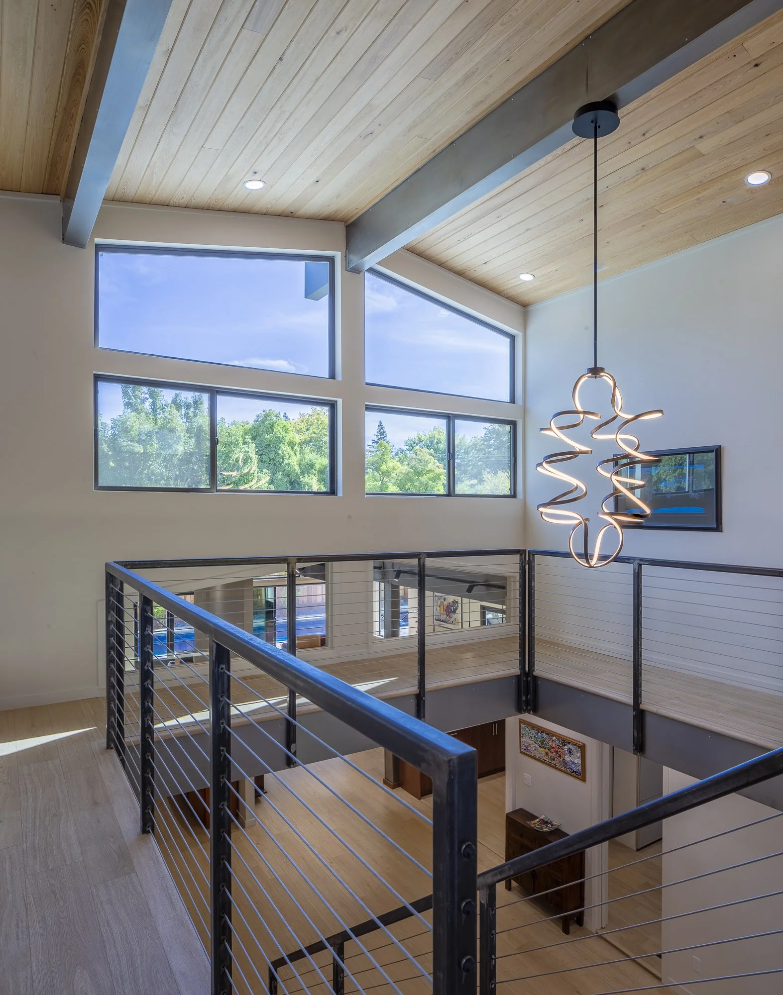 The home provides communal and private spaces for the multigenerational family. The upper level contains children’s and guest bedrooms. Its circulation path overlooks the entry, game room to the side, and great room towards the back. Strategically pl
