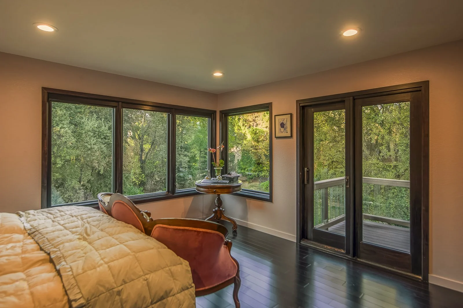 The subtly warm-hued master bedroom is a delicate rose-bud shade.