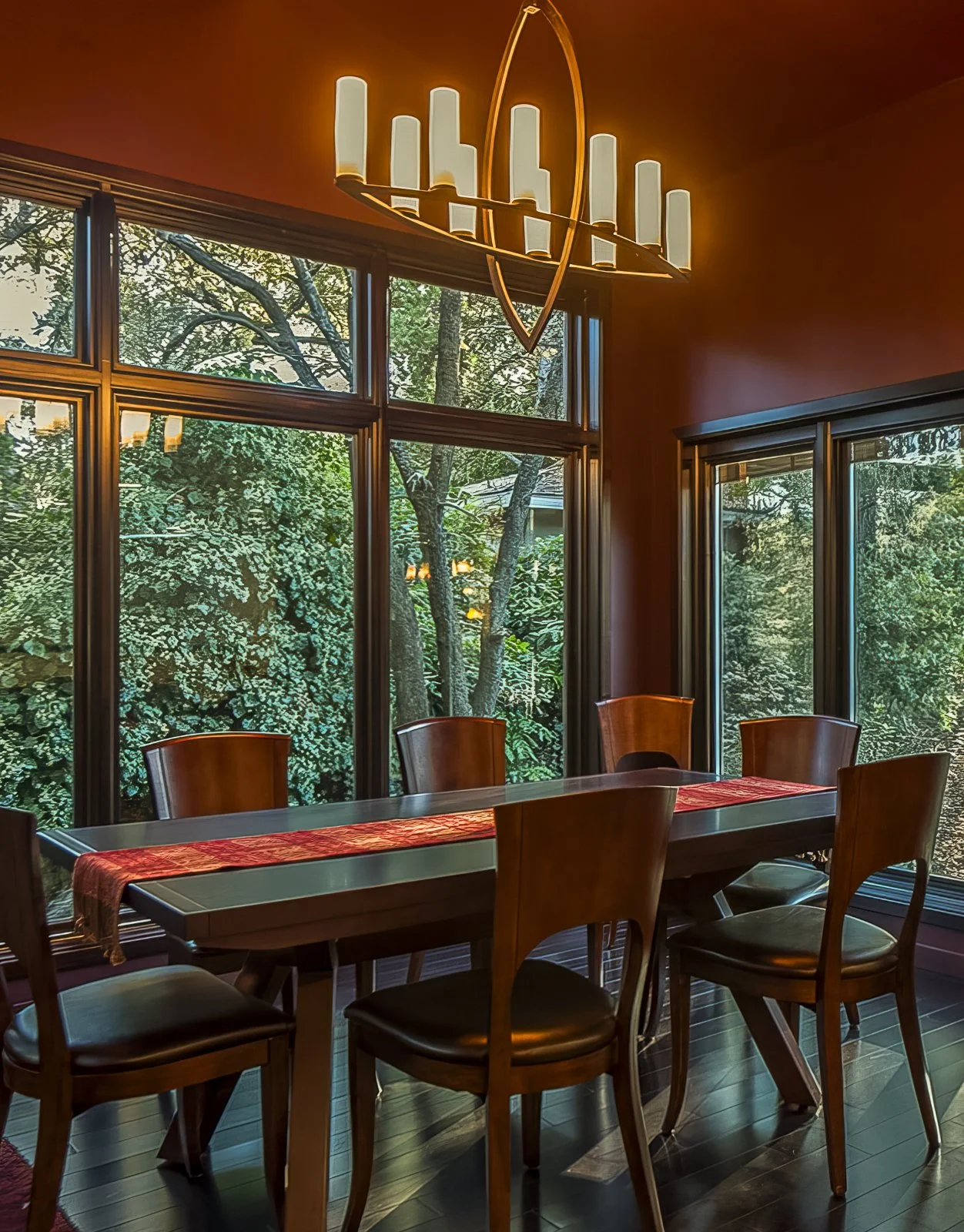 The dining room sits in a new small nook, an intimate space with windows on three sides. We painted the walls a deep, rich burgundy shade called brinjal, hand-crafted with quality minerals and exclusive pigments in Dorset, England, by Farrow & Ball,