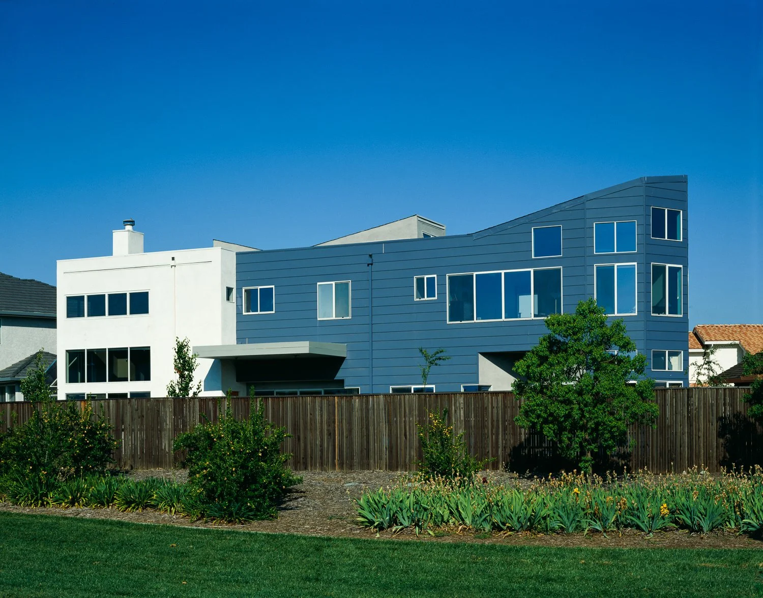 The home backs onto a continuous neighborhood greenbelt, extending its feeling of spaciousness.