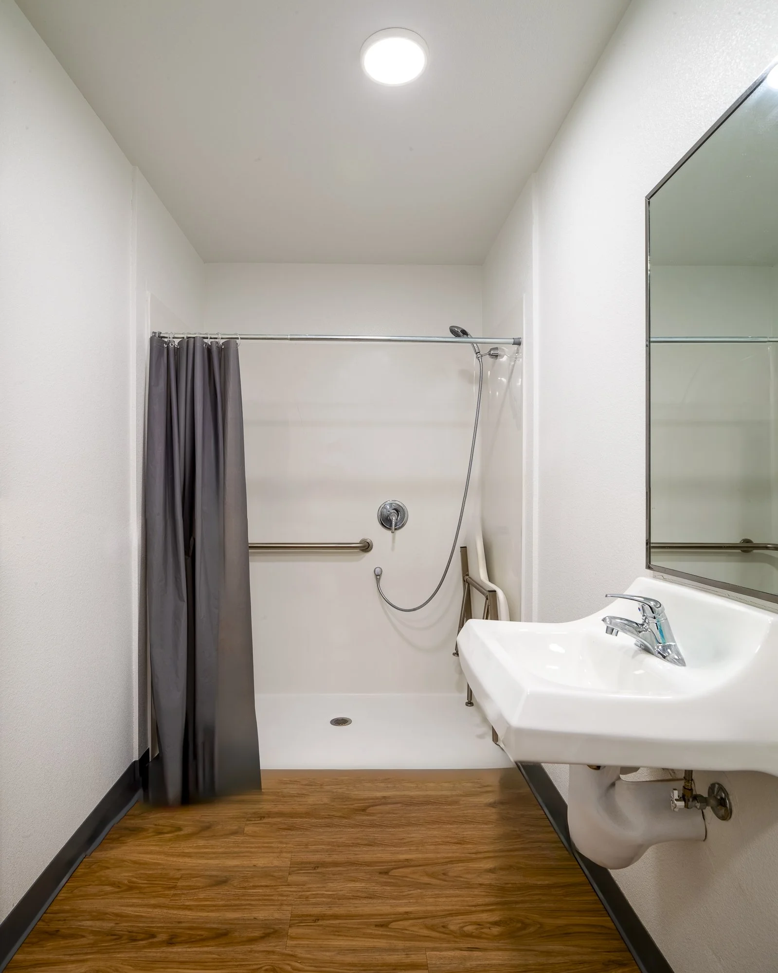 The floor provides shared handicap-accessible bathrooms.