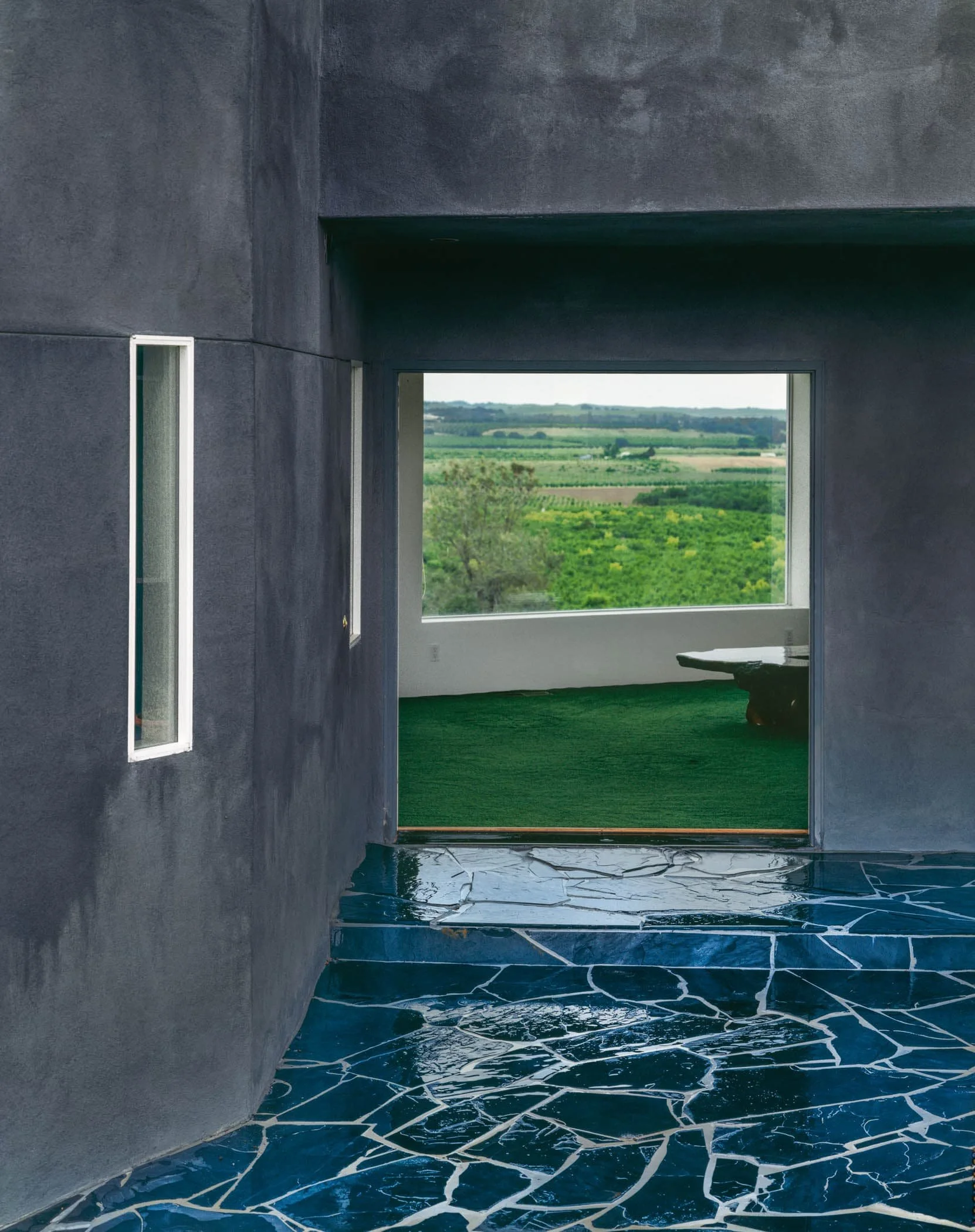 The home celebrates views at different scales, from large window walls to intimate spaces for quiet reflection.