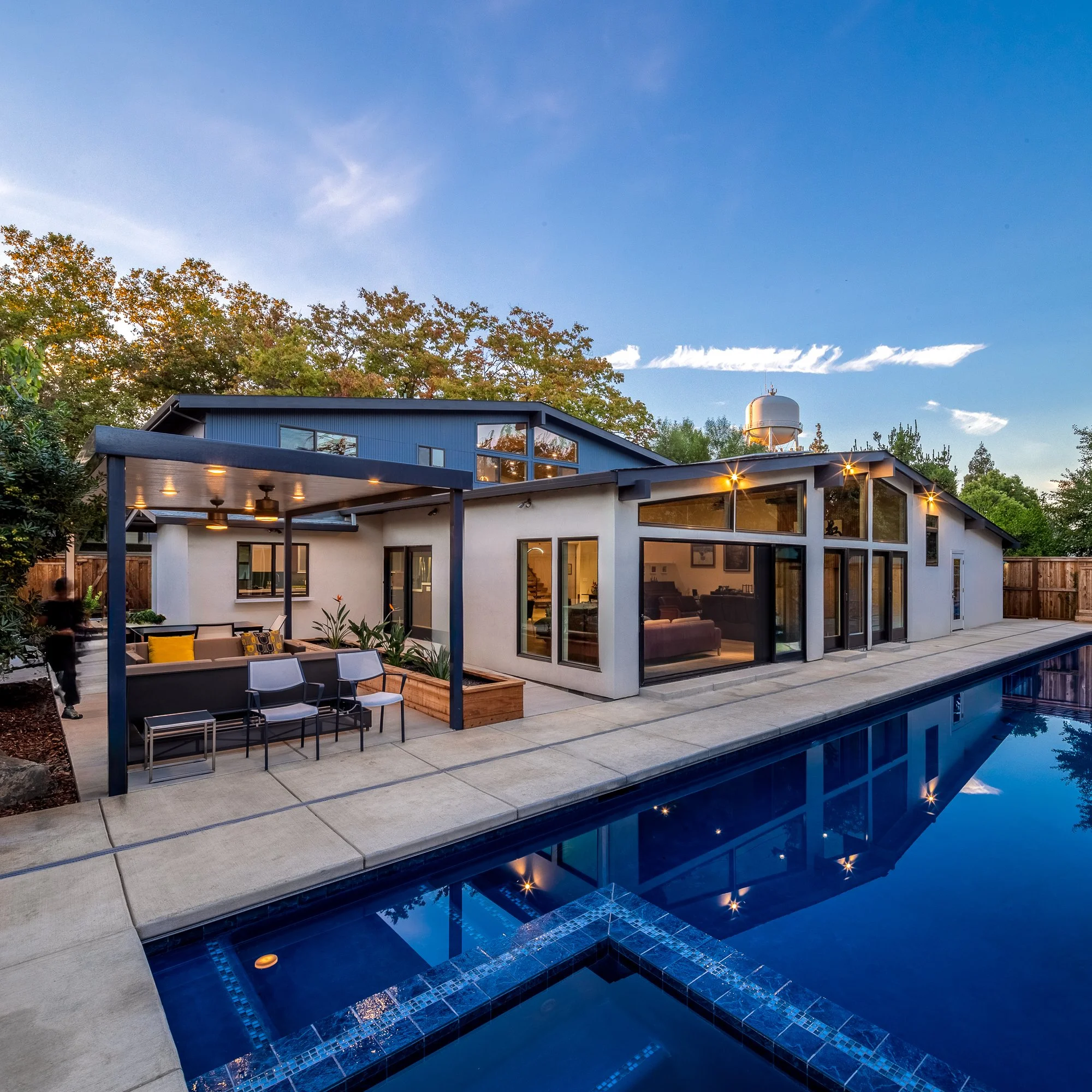 The backyard is another great room with places to work, eat, and play. 