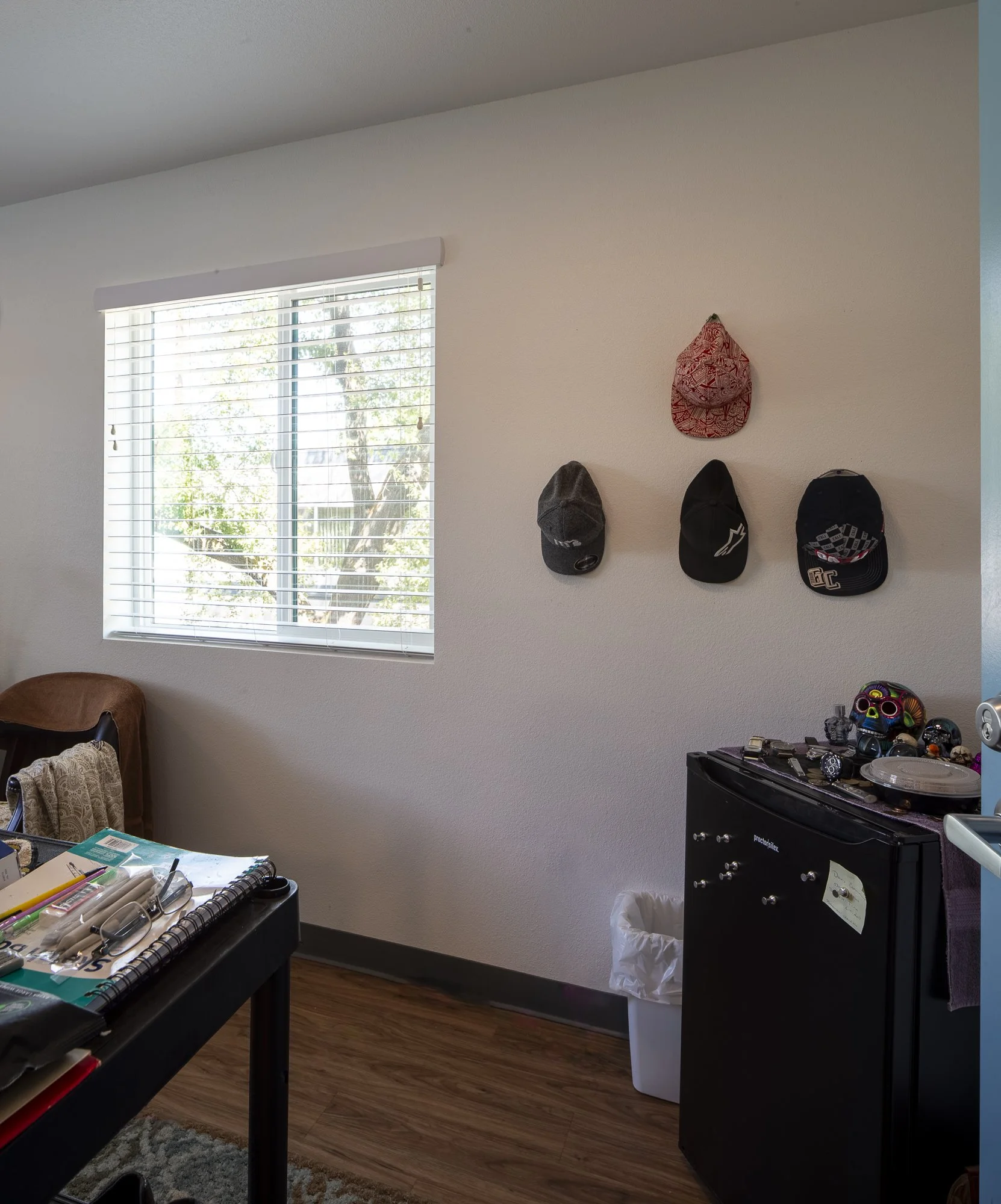 A private unit enables self-expression like this hat collection display.