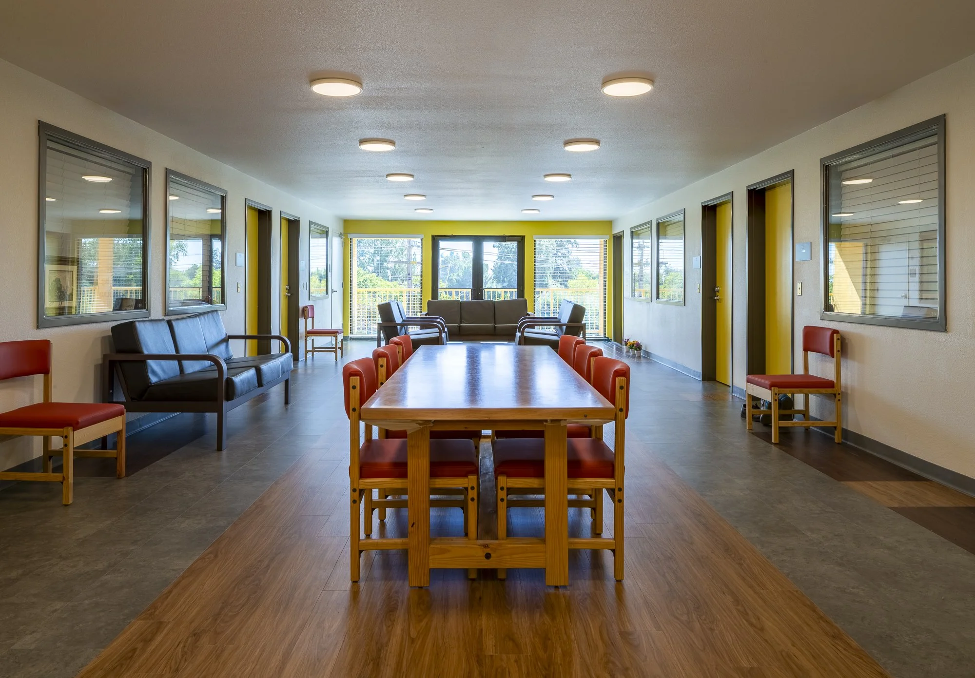 While each unit on these floors has an individual kitchen and bathroom, the floor's central area acts as a piazza for gathering and socialization, connecting to a sunny, shared balcony.