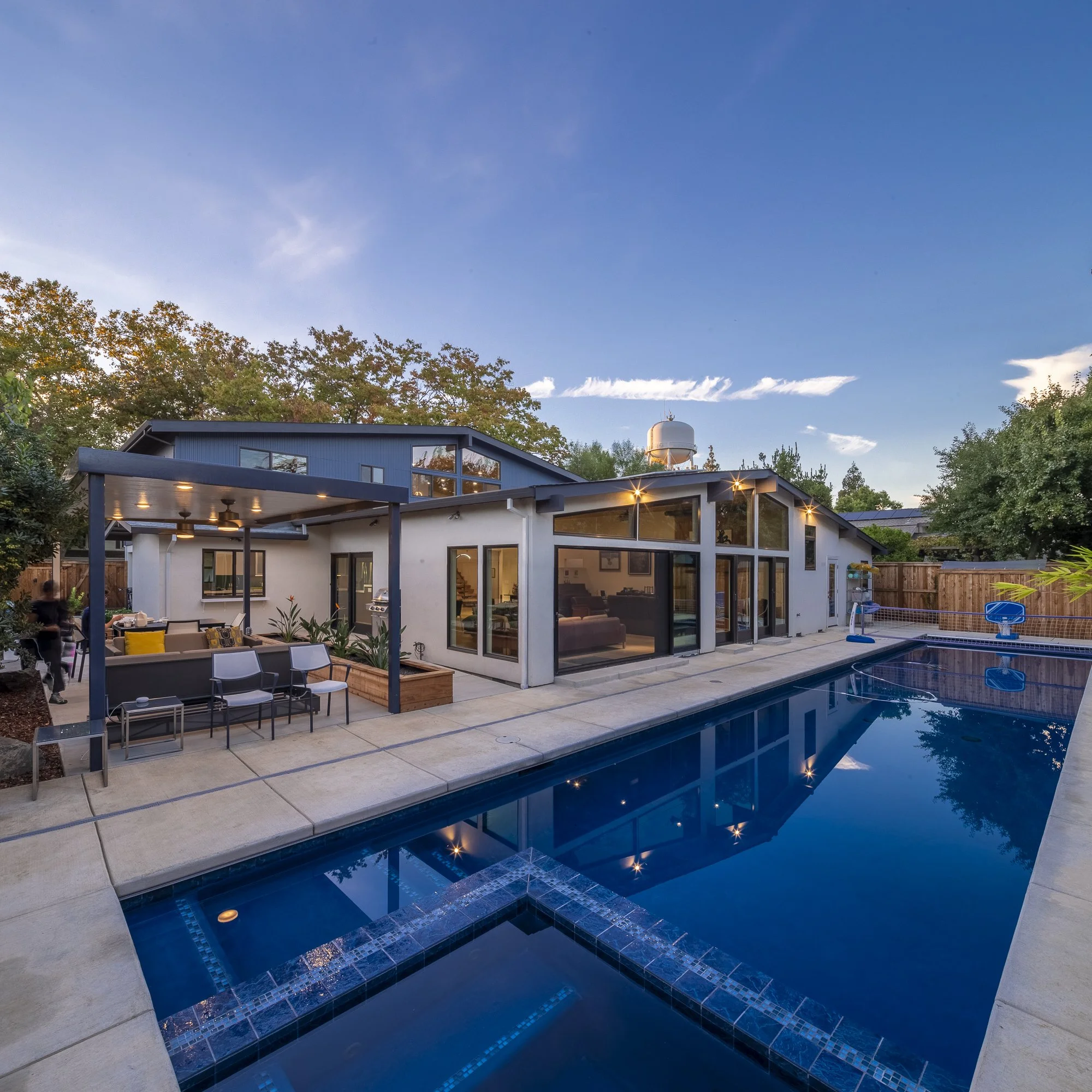 The backyard is another great room with places to work, eat, and play.