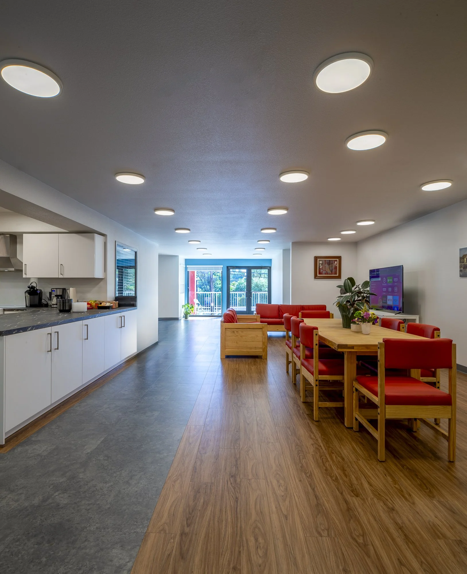 The kitchen is part of a larger shared space for gathering, an indoor piazza.