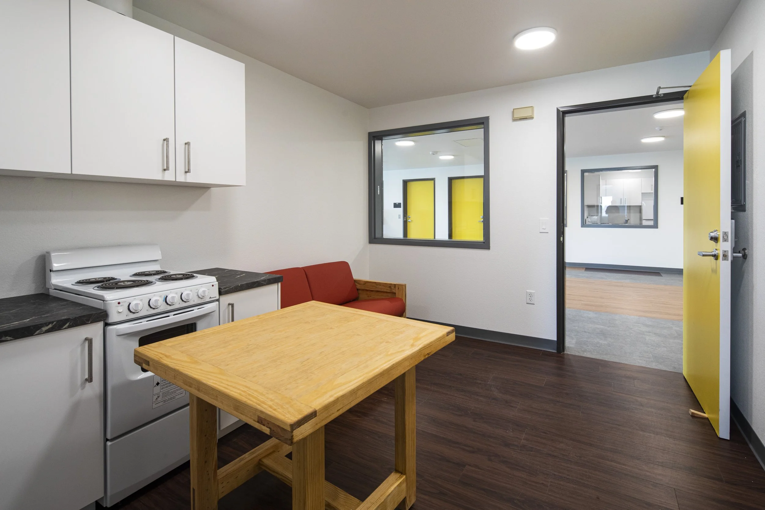 Each kitchen visibly connects to the shared piazza in the middle of each floor, fostering a feeling of connectedness.