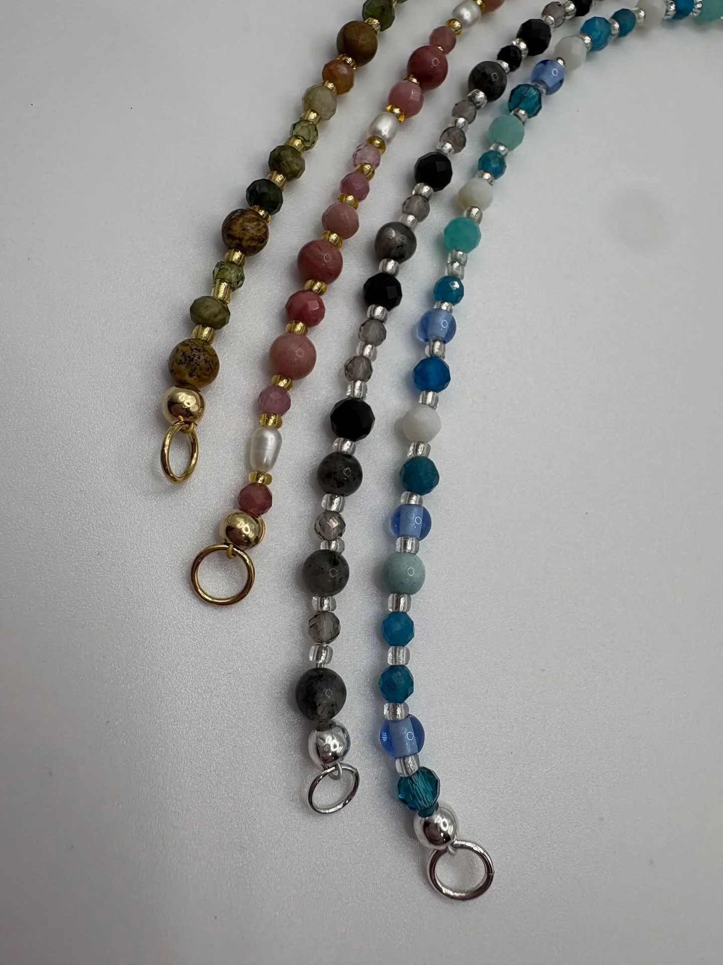 Your Heart&rsquo;s Archive, rewritten in gemstone glow.
Drumroll, please&hellip; meet the new line up of sparkles: Aura, Nova, Tide, and Luna
Your four new favourite things to wear (and never take off).
Mix, match, charm up &mdash; and let your heart