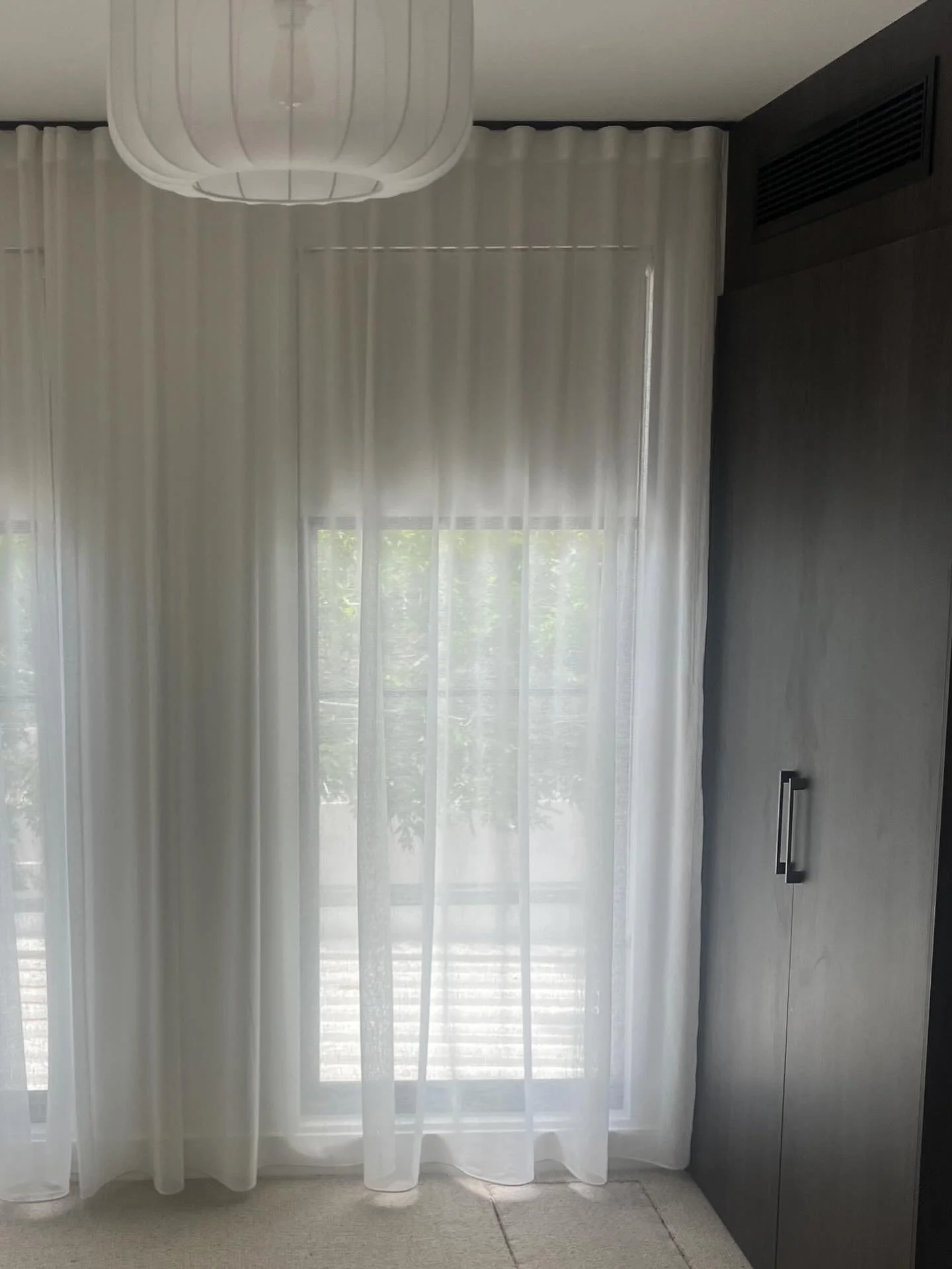 Soft furnishings on point! Luxury wool carpet, calm colour palette in Dulux Natural White, gorgeous sheers to filter the morning light. South Melbourne Project.