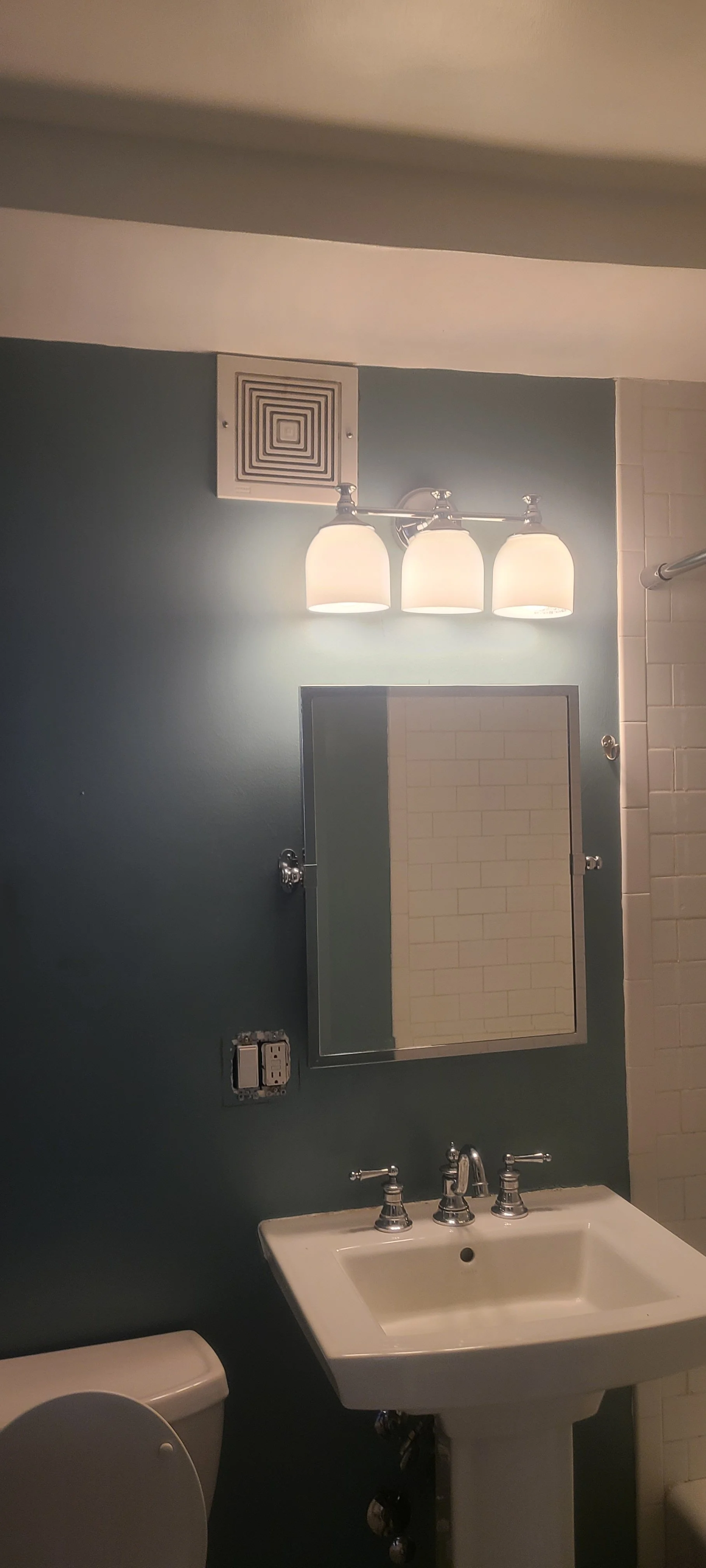 Blue bathroom with white sink