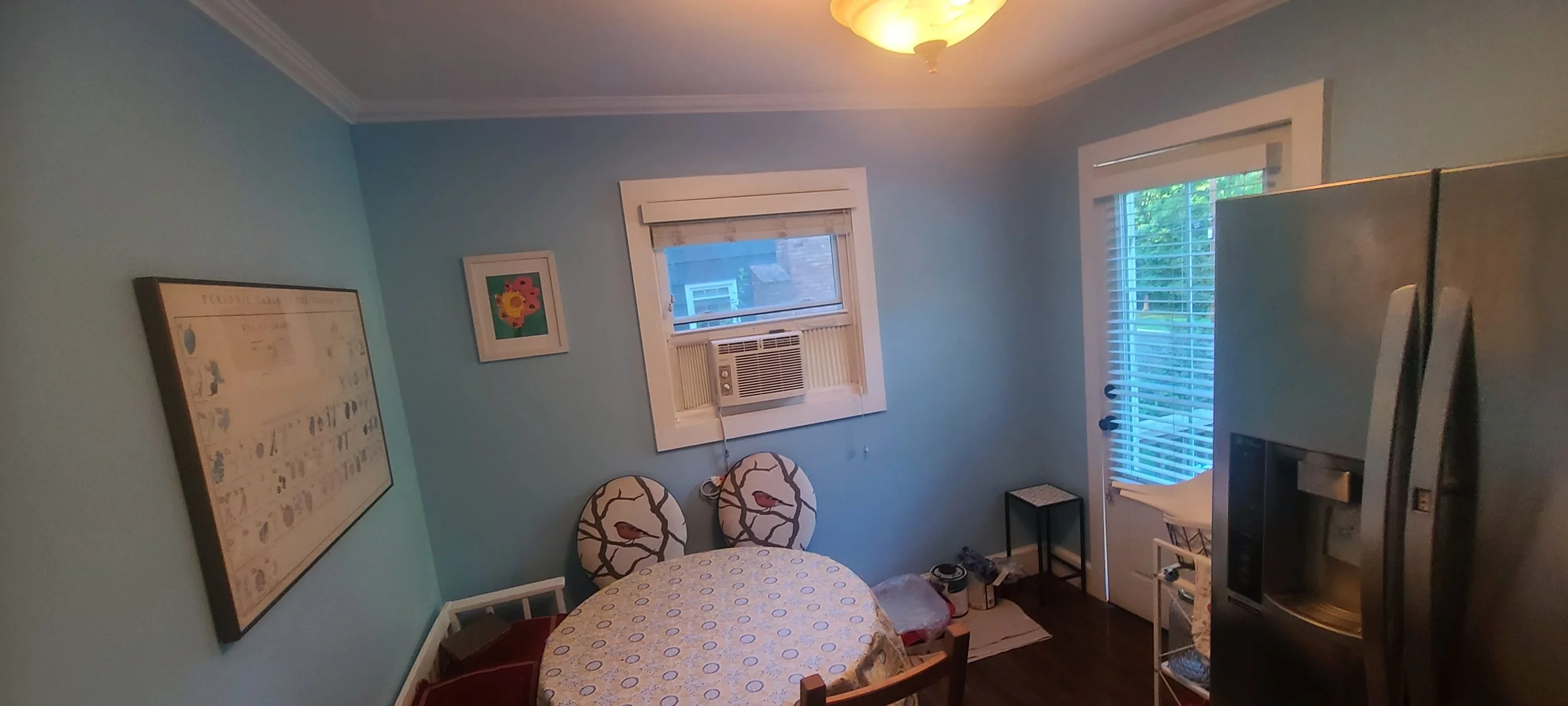 Freshly painted sky blue room with white trim