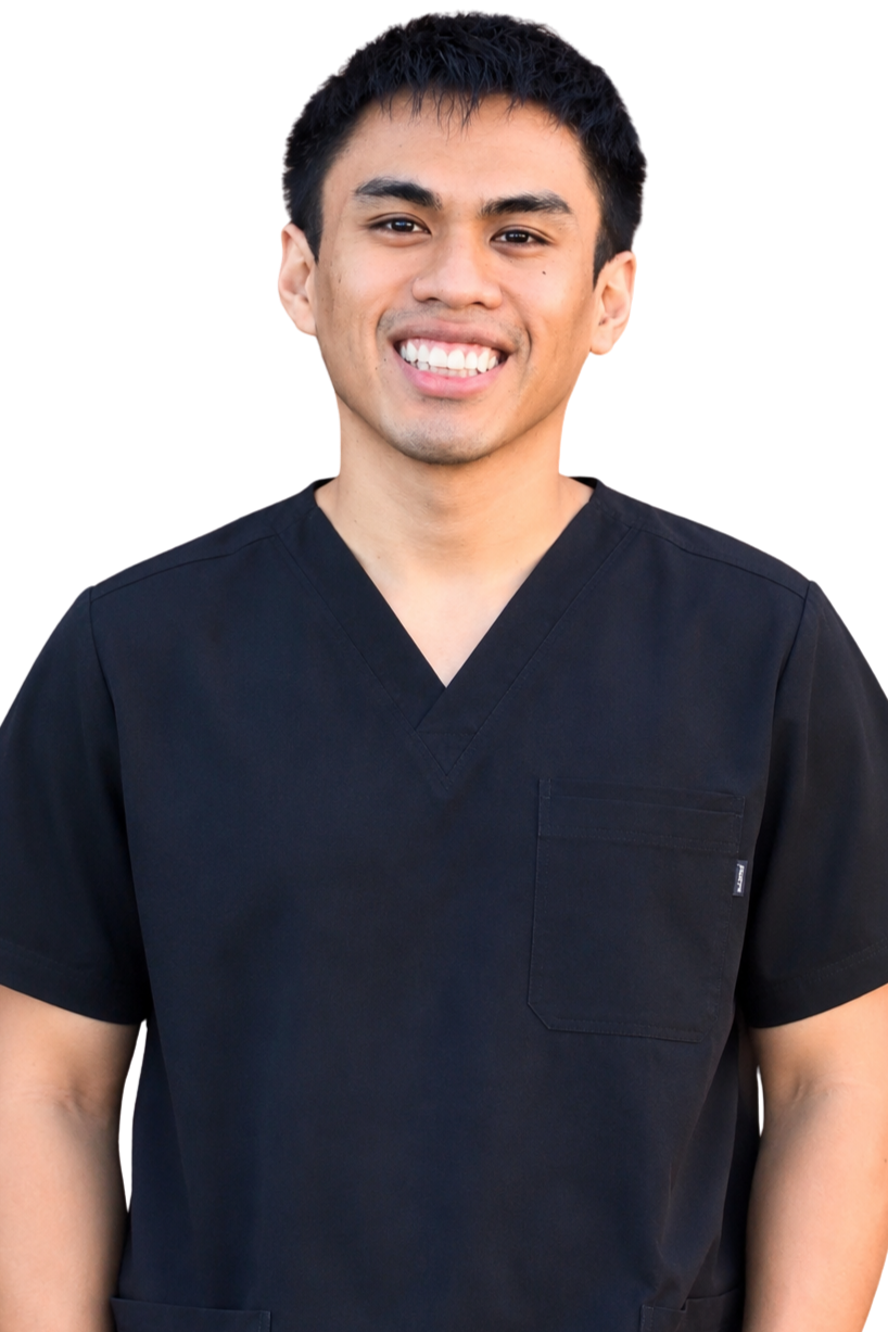 A young man smiling, wearing black medical scrubs against a transparent background.