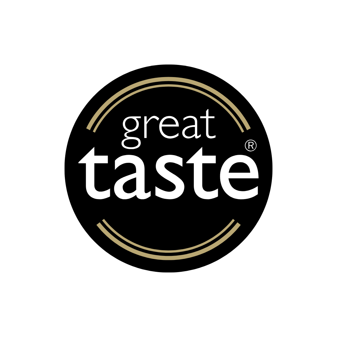 Circular black logo with gold concentric circles and white text that reads 'great taste' in the center.