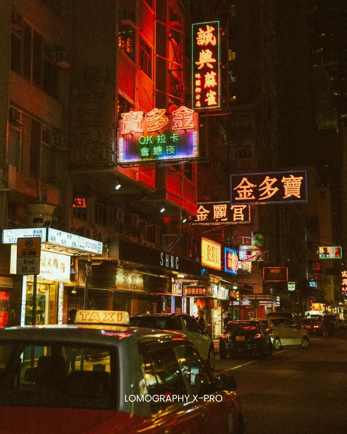 Before/After: Lomography X-Pro preset. Adds bold, high-contrast cross-processed vintage colors to a dark street scene.