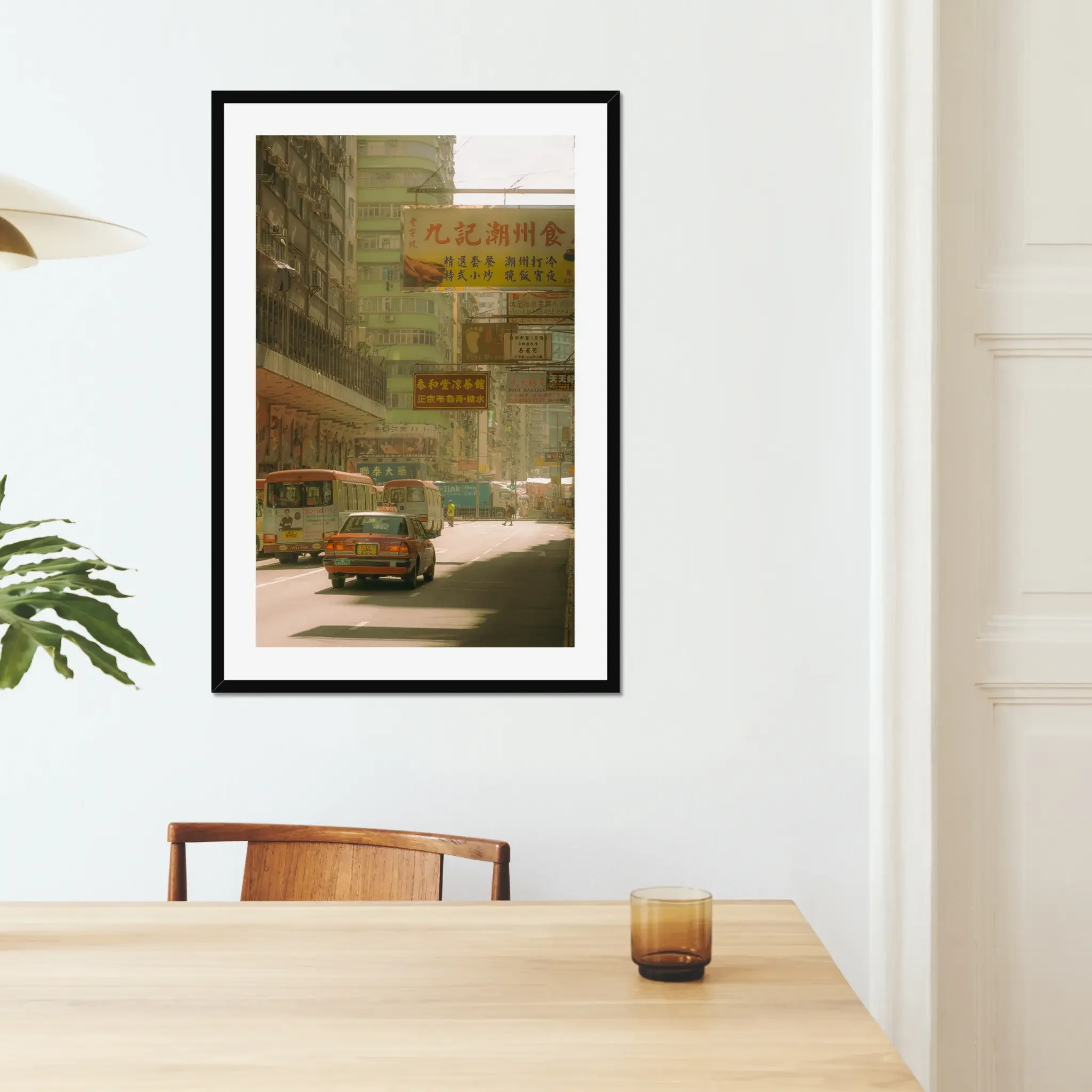 Sun-drenched Hong Kong street photography fine art print. Cinematic urban scene with a red taxi, minibuses, and layered vintage signs. Warm amber wall art decor.