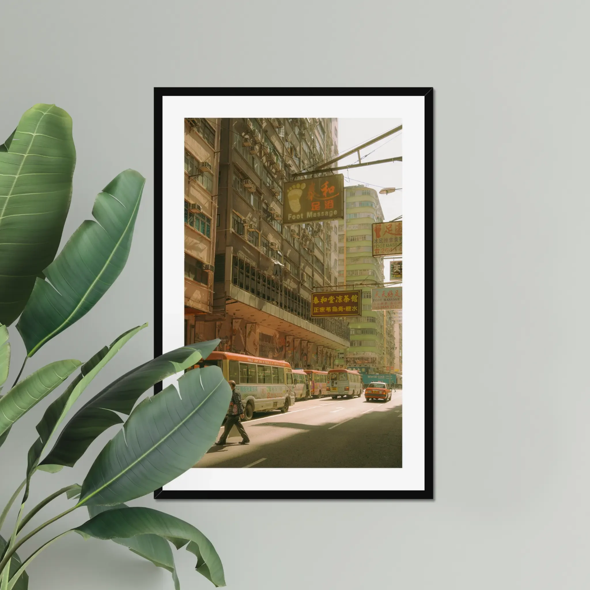 Sun-drenched Hong Kong street photography fine art print. Cinematic urban scene with red-topped minibuses, a red taxi, vintage signs, and a pedestrian crossing. Warm amber wall art decor.
